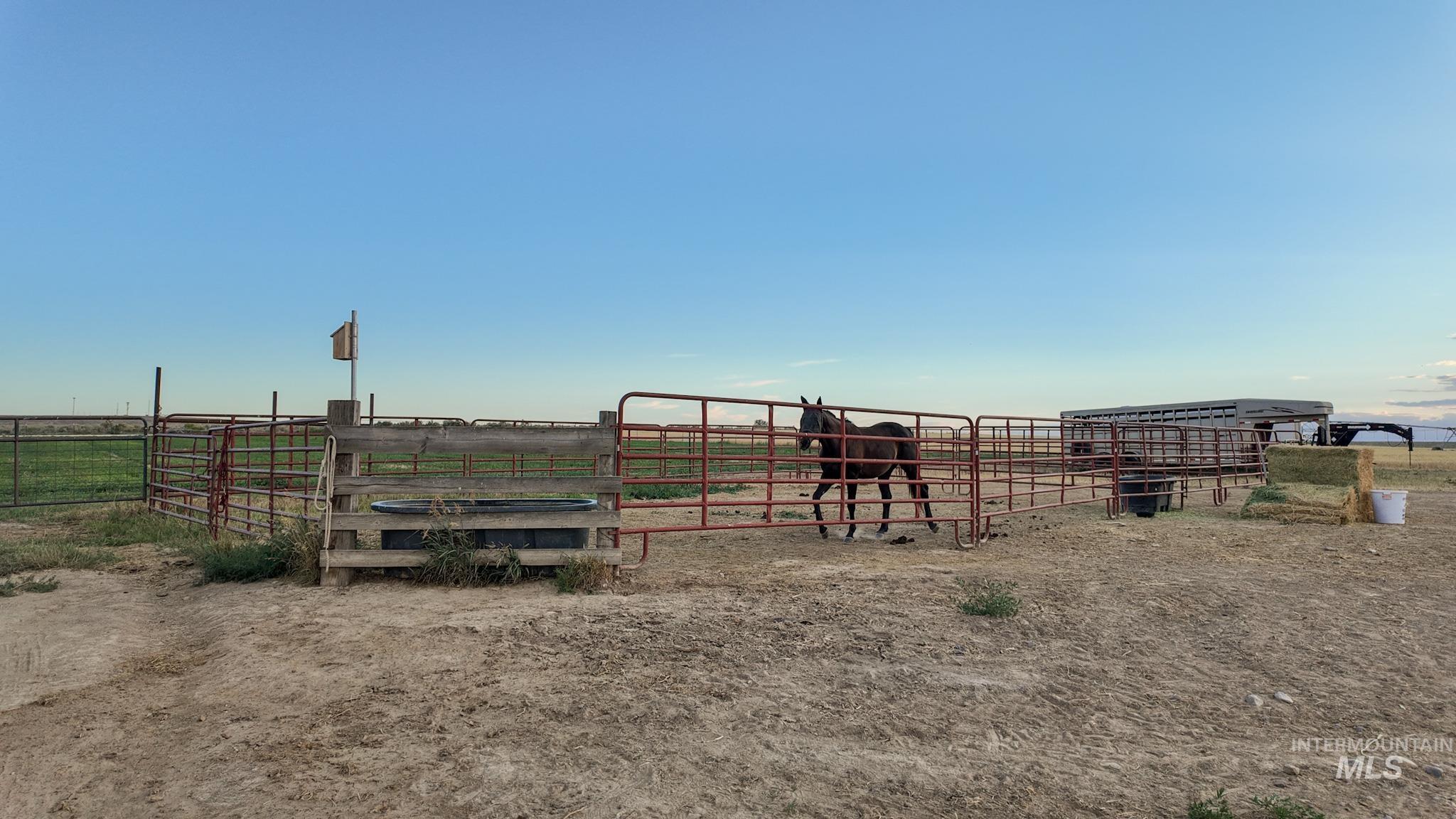 View of yard featuring a view of rural / pastoral area, an outbuilding, and an exterior structure