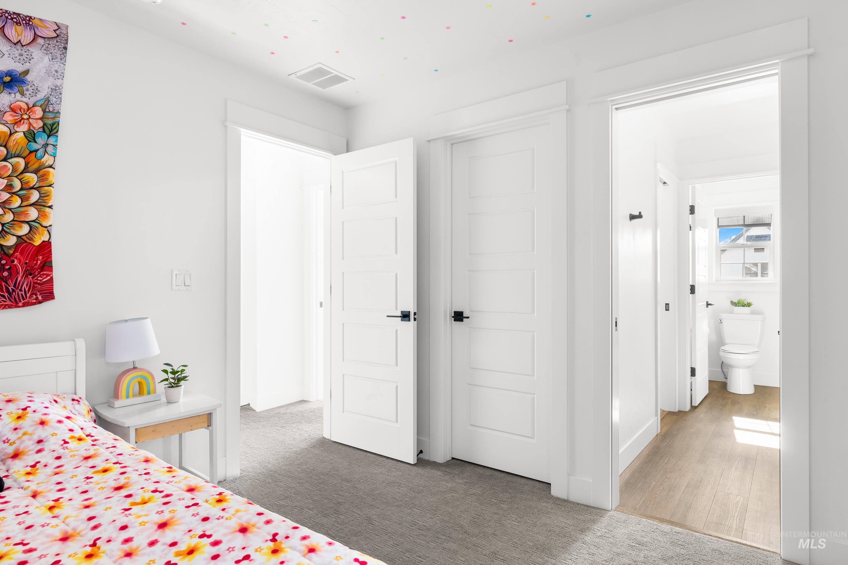 Bedroom with light carpet