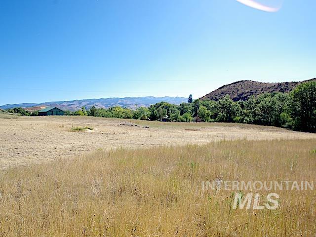 View of mountain background featuring rural landscape