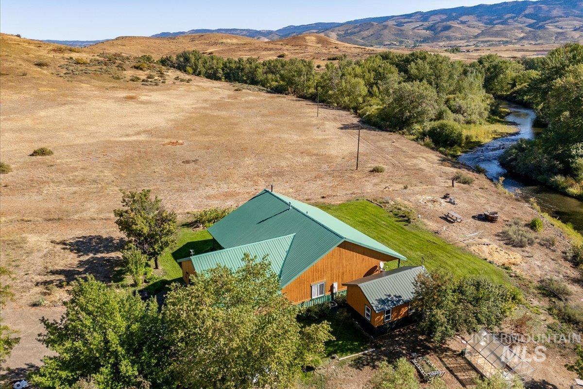 Aerial view of sparsely populated area featuring a mountain backdrop