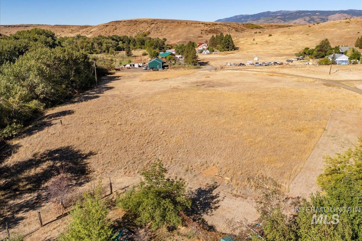 Overview of rural landscape featuring a mountain backdrop