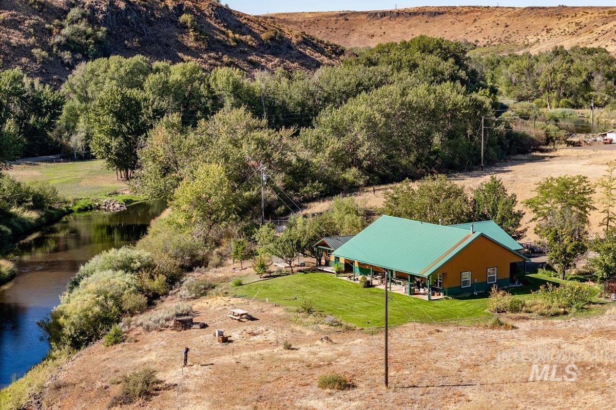 View from above of property featuring a water and mountain view