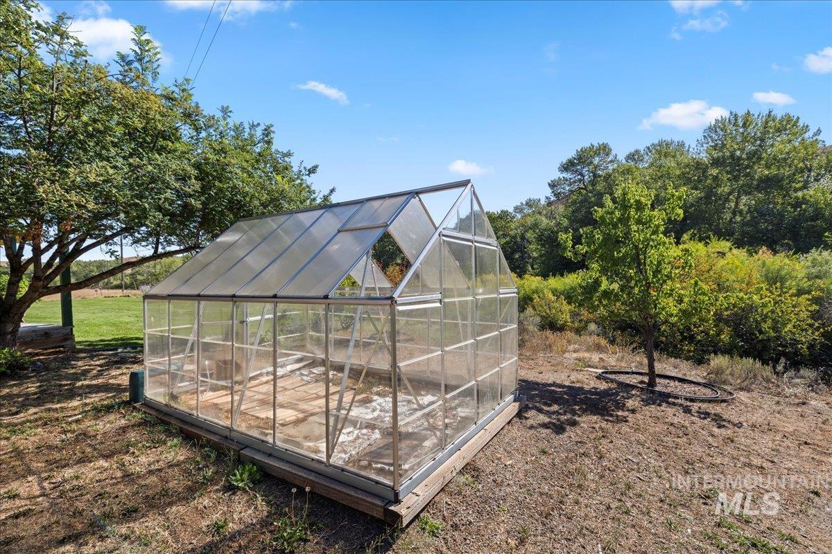 View of greenhouse featuring a sunroom