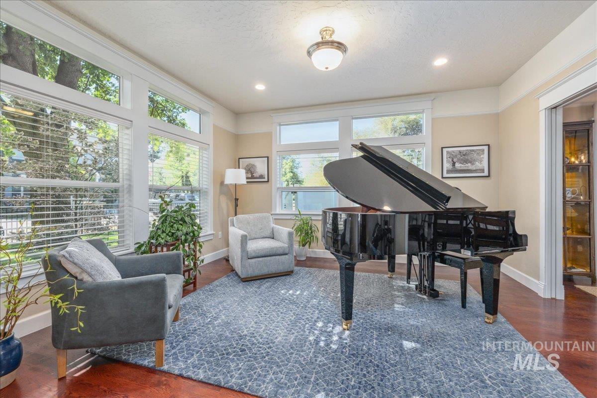Living area featuring dark wood finished floors, recessed lighting, and a textured ceiling