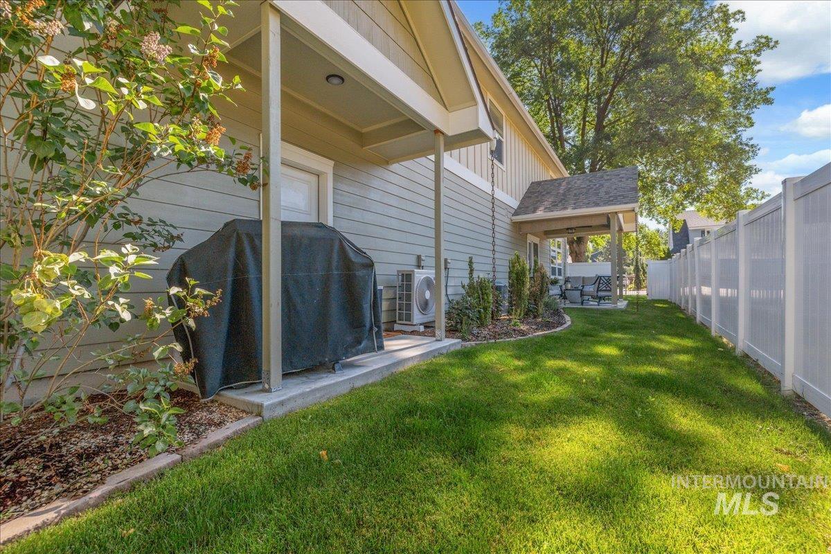 Fenced backyard featuring a gazebo and a patio