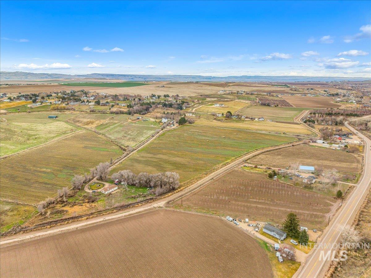View of rural area featuring abundant farmland and mountains