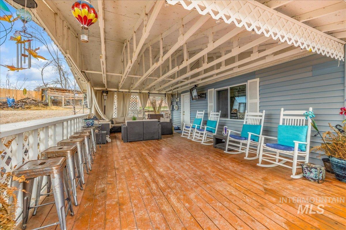 Wooden terrace featuring outdoor furniture