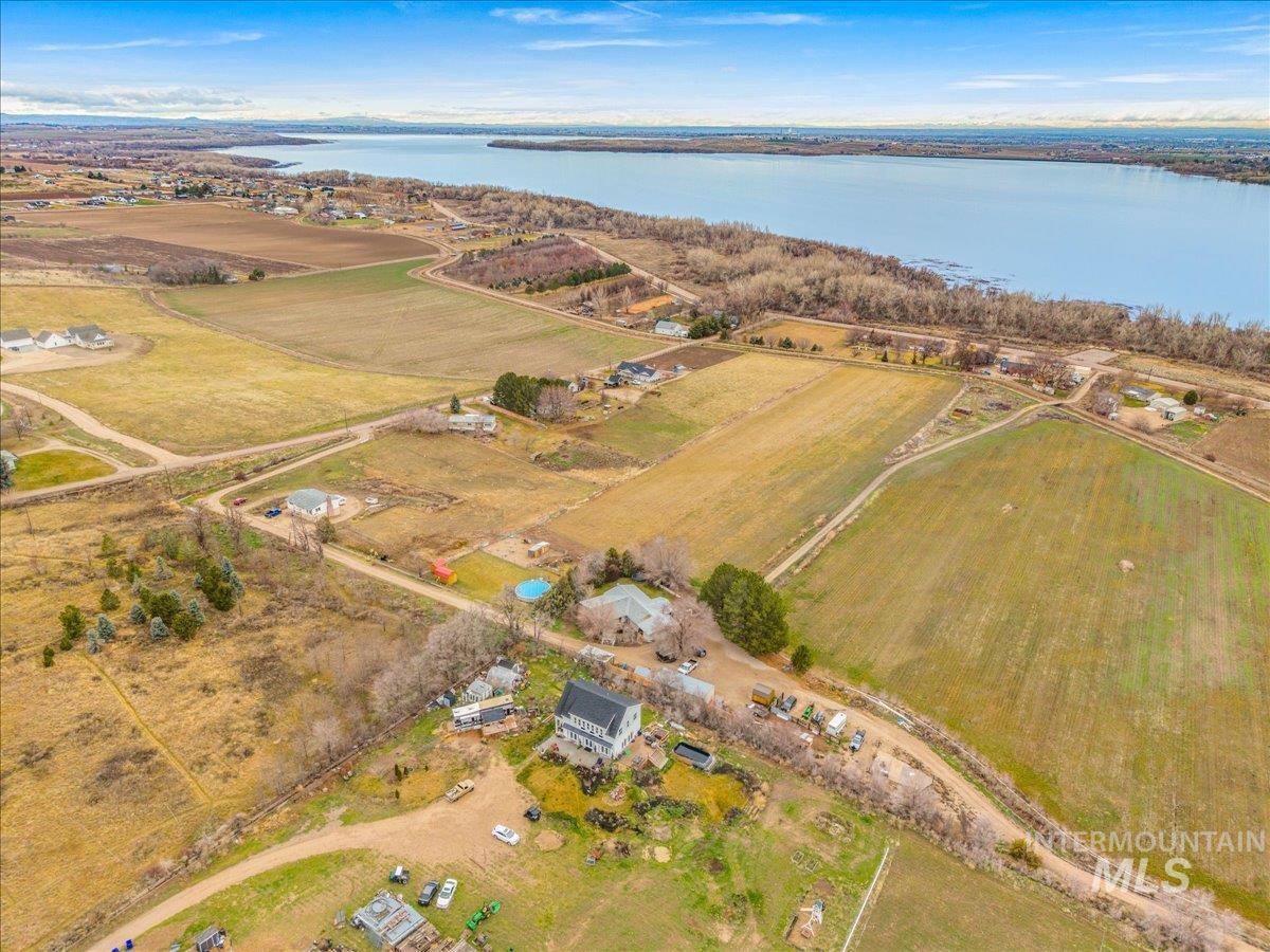 View of rural area with a nearby body of water and abundant farmland