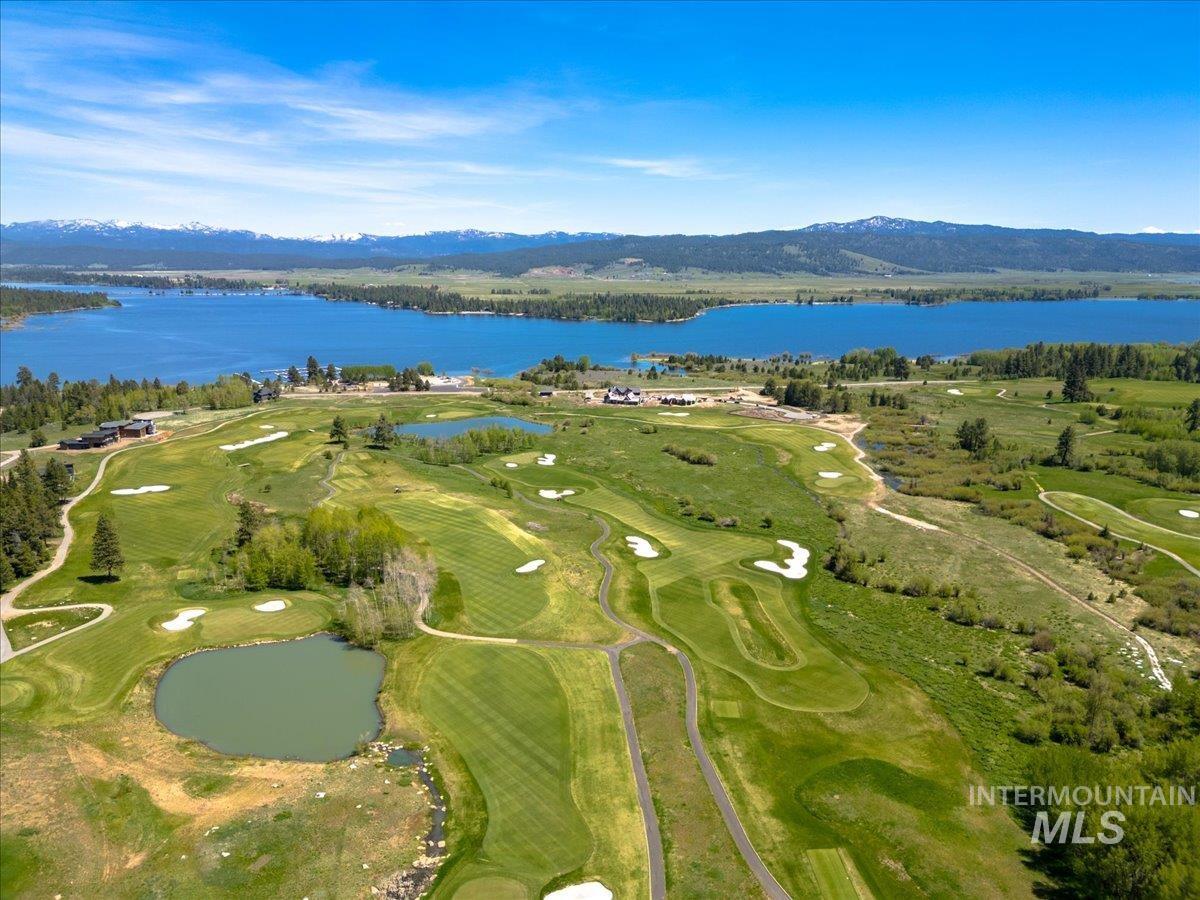 Expansive golf course with manicured greens and water features