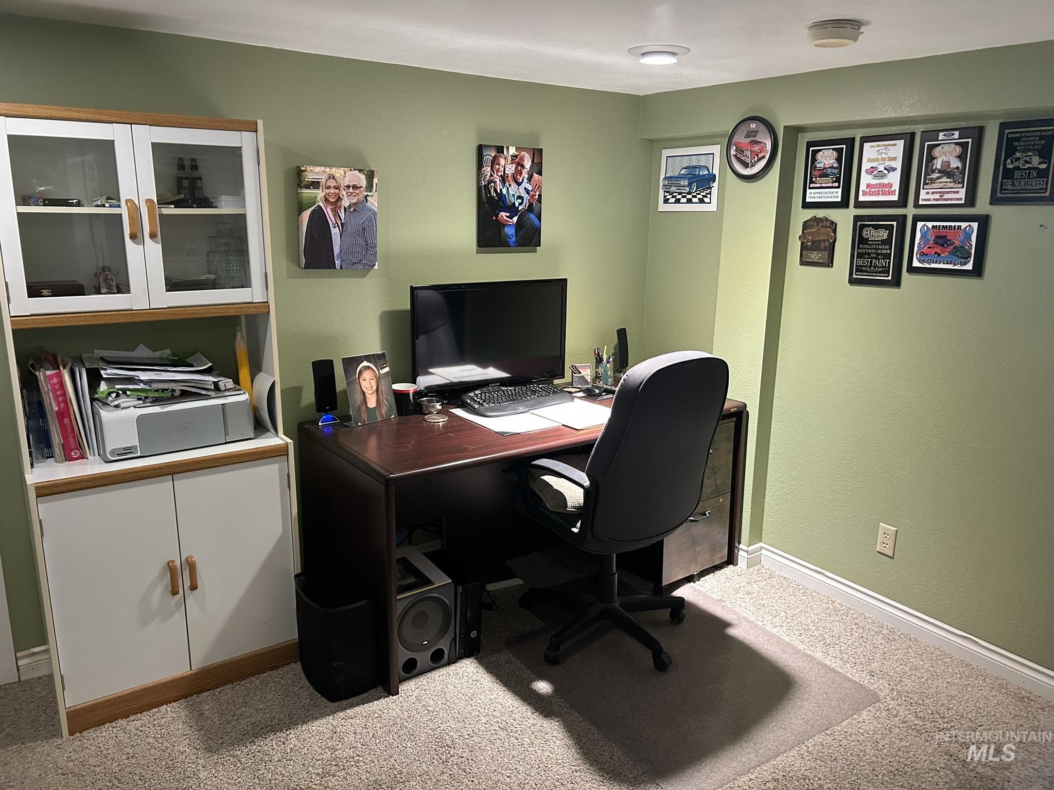 Office area with carpet flooring