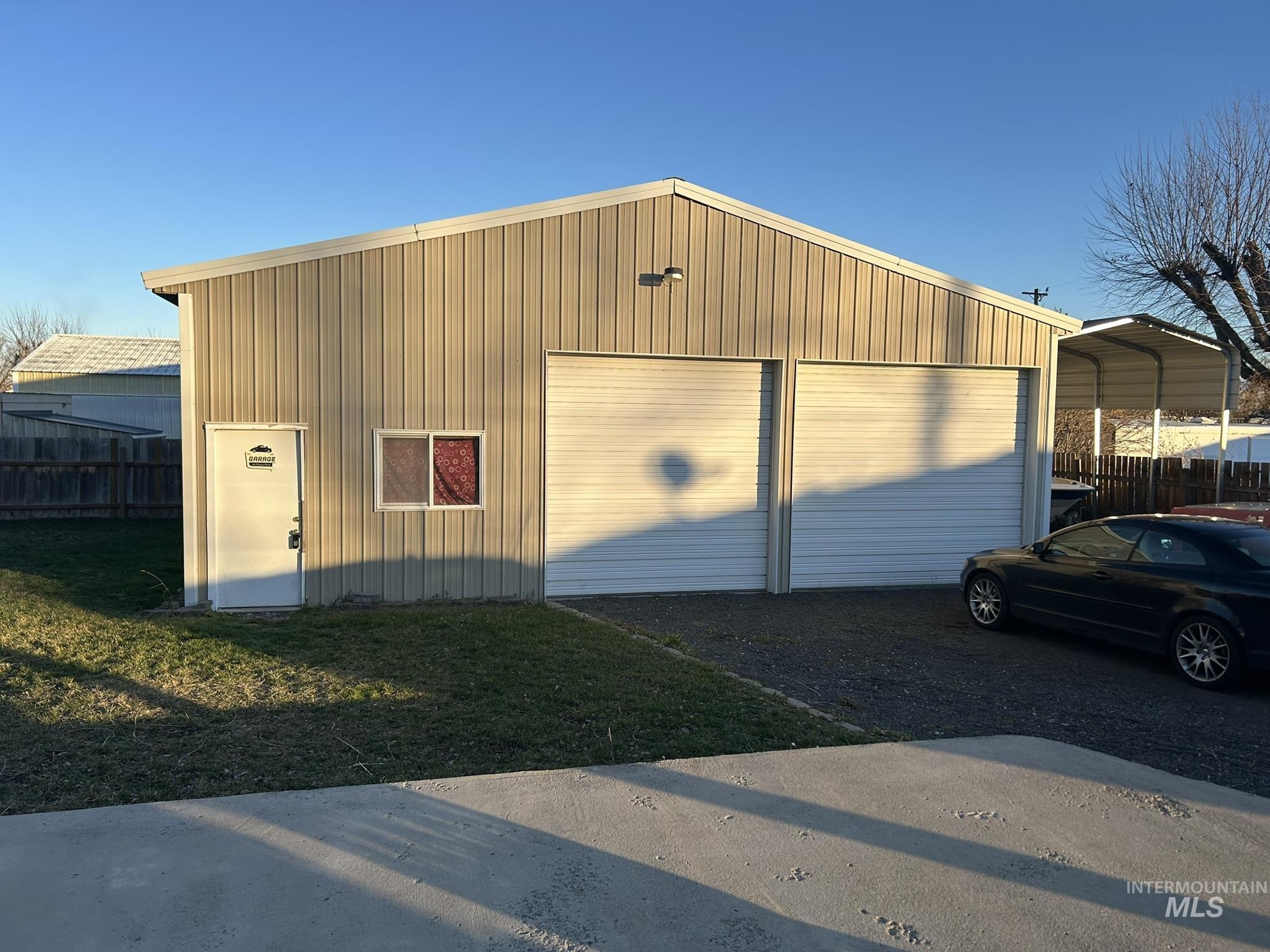 Detached garage with a carport
