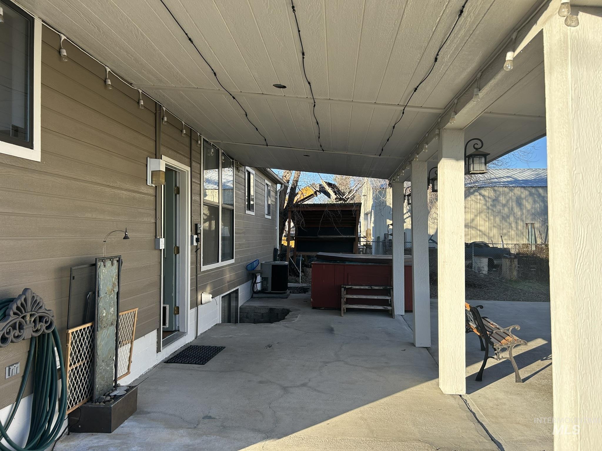 View of patio featuring a hot tub