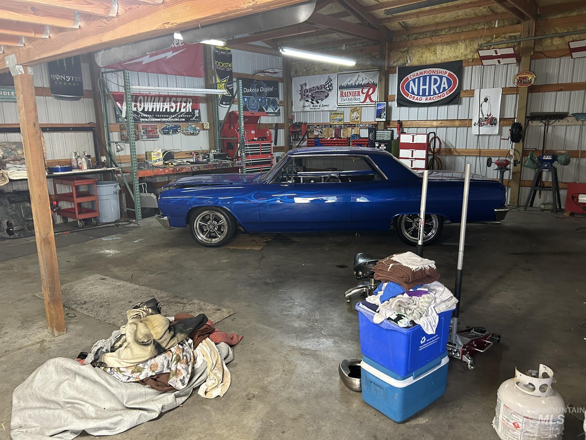 Garage with metal wall and a workshop area