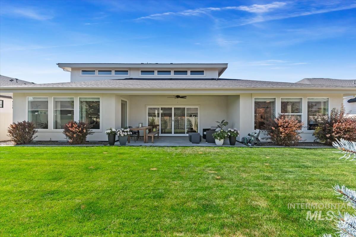 Expansive green lawn with a contemporary stucco exterior