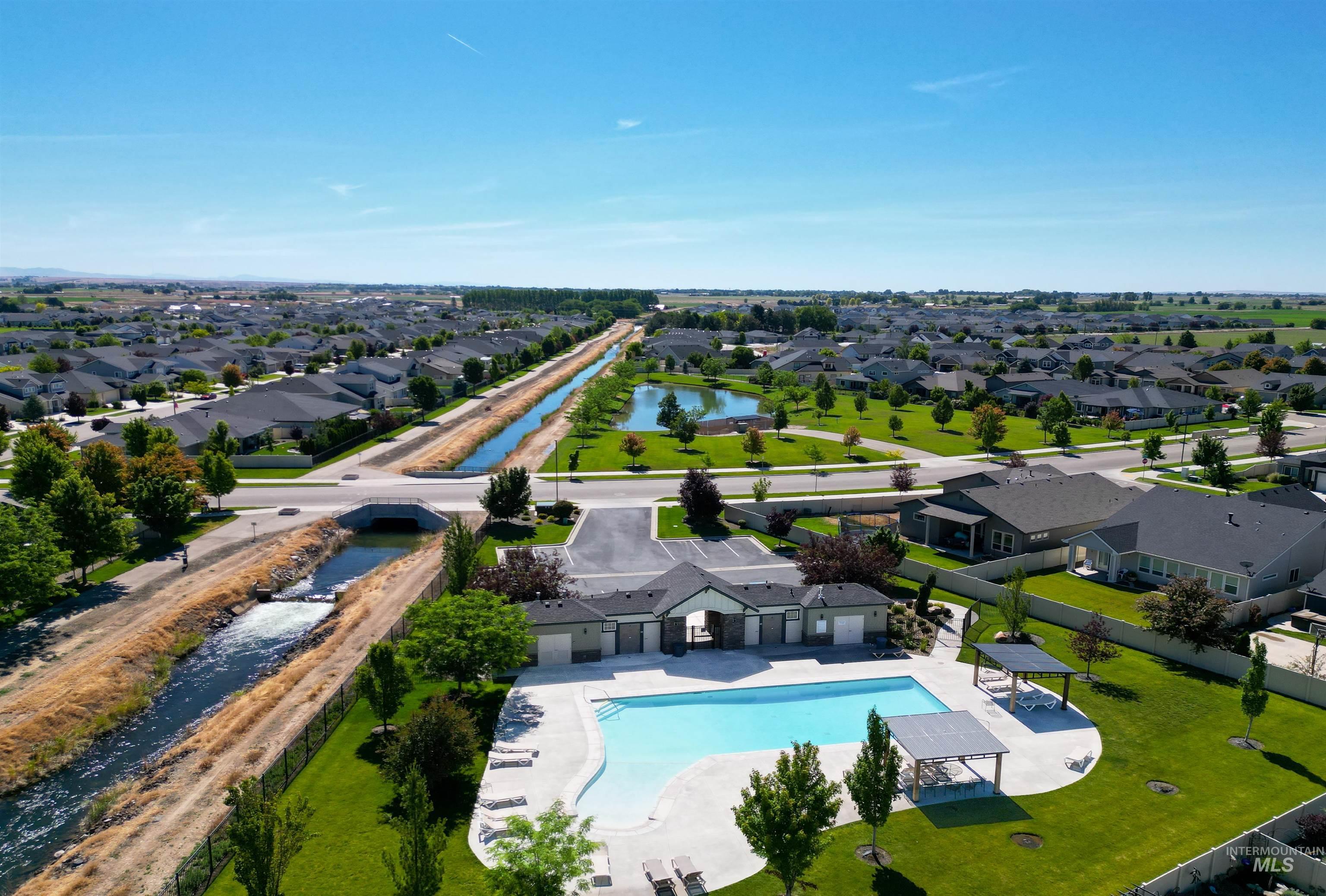 Aerial perspective showcasing a residential community with an amenity complex