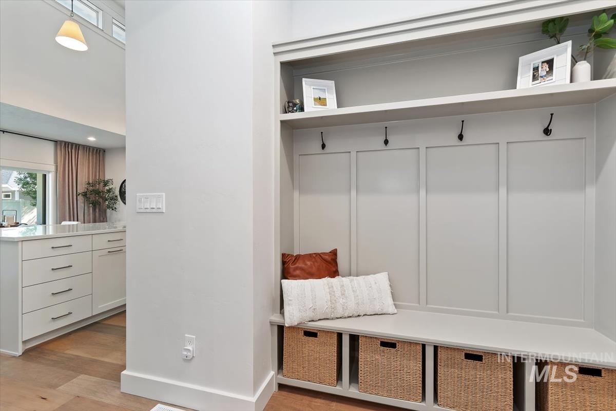 Built-in mudroom bench with paneled backing and storage cubbies