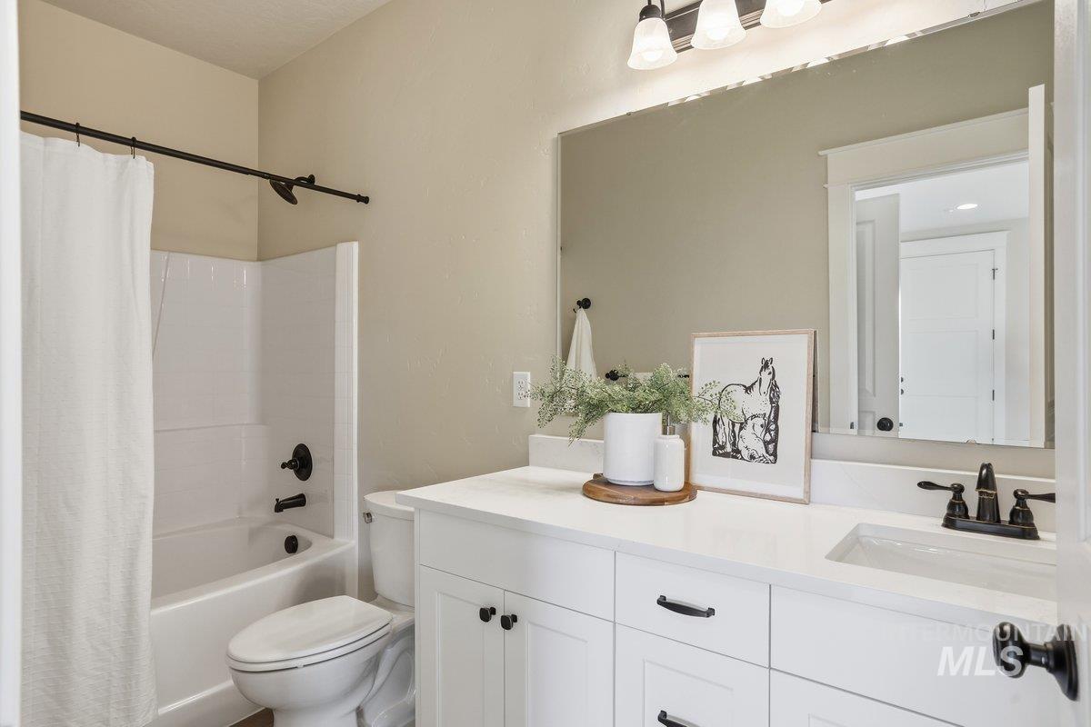 Full bath with shower / bath combo and vanity