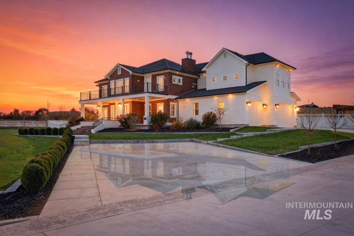 View of front facade with a porch and a chimney