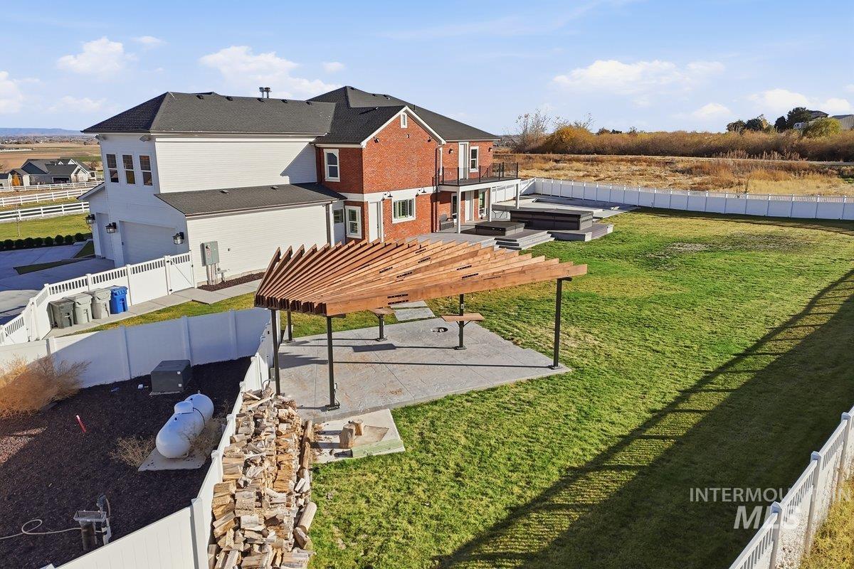 View of home's community with a fenced backyard, a residential view, a pergola, and a patio