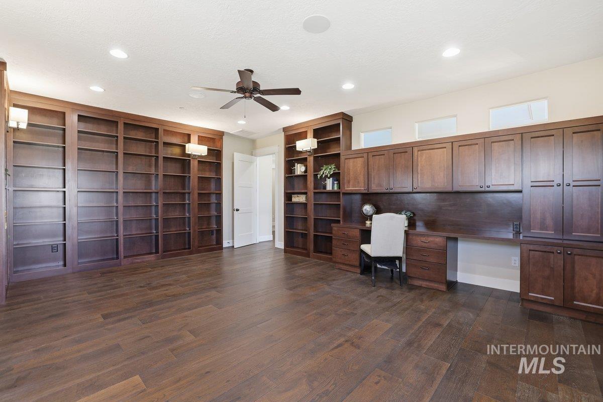 Office area with a ceiling fan, built in study area, dark wood-style floors, recessed lighting, and a textured ceiling