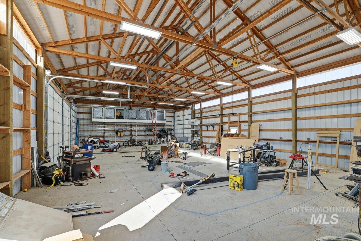 Garage featuring metal wall and a workshop area