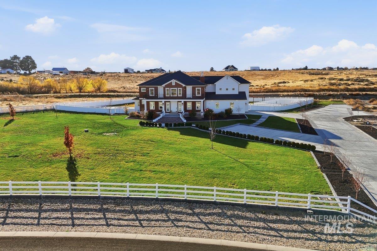 View of front of house featuring a view of rural / pastoral area and covered porch
