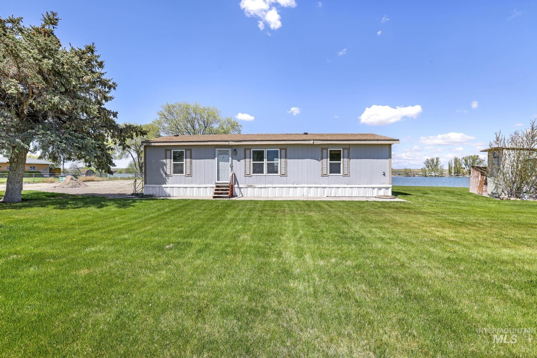 View of front of home featuring a front yard and entry steps