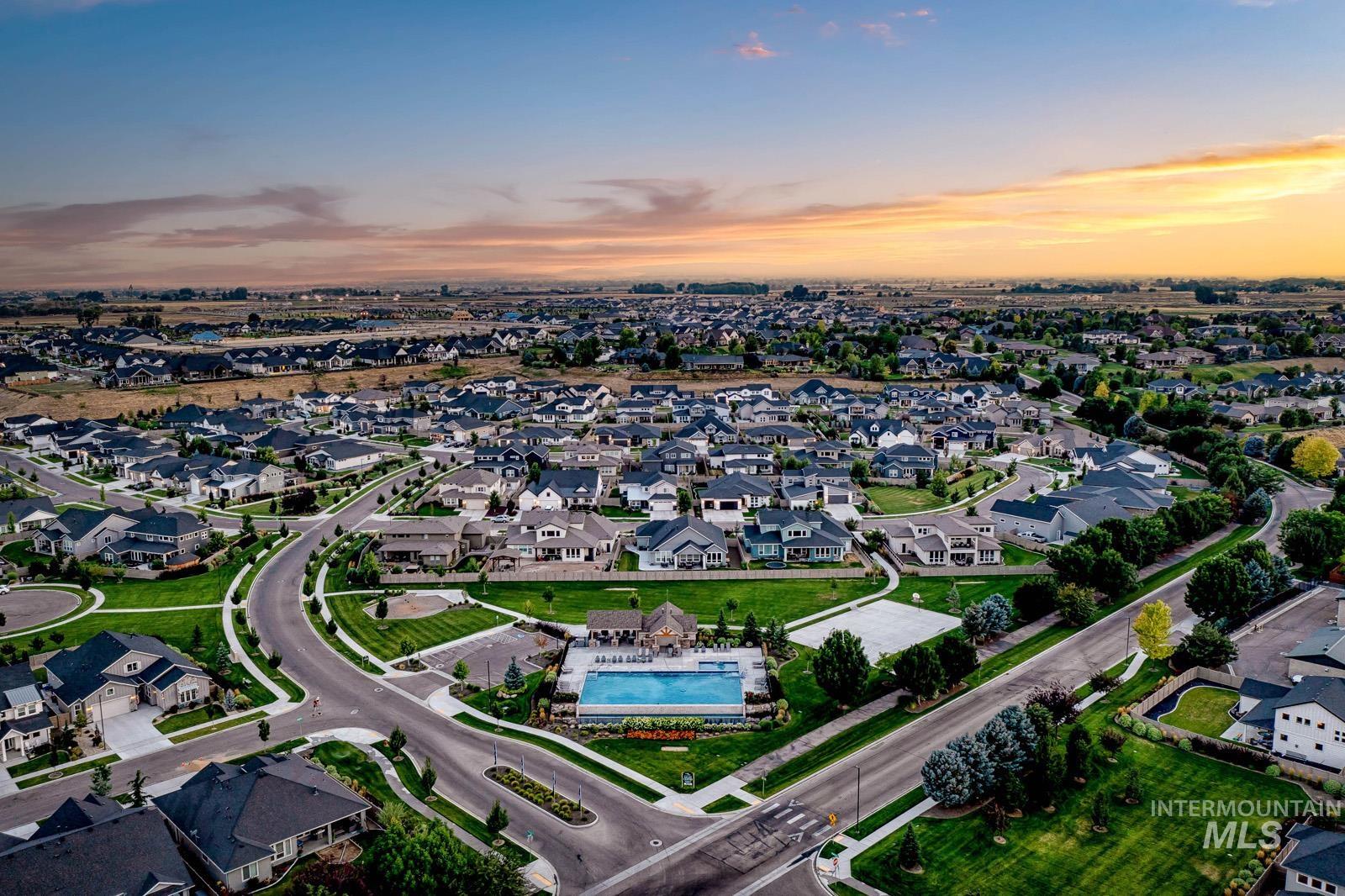 Residential development featuring extensive streetscapes, mature landscaping, and a central swimming pool