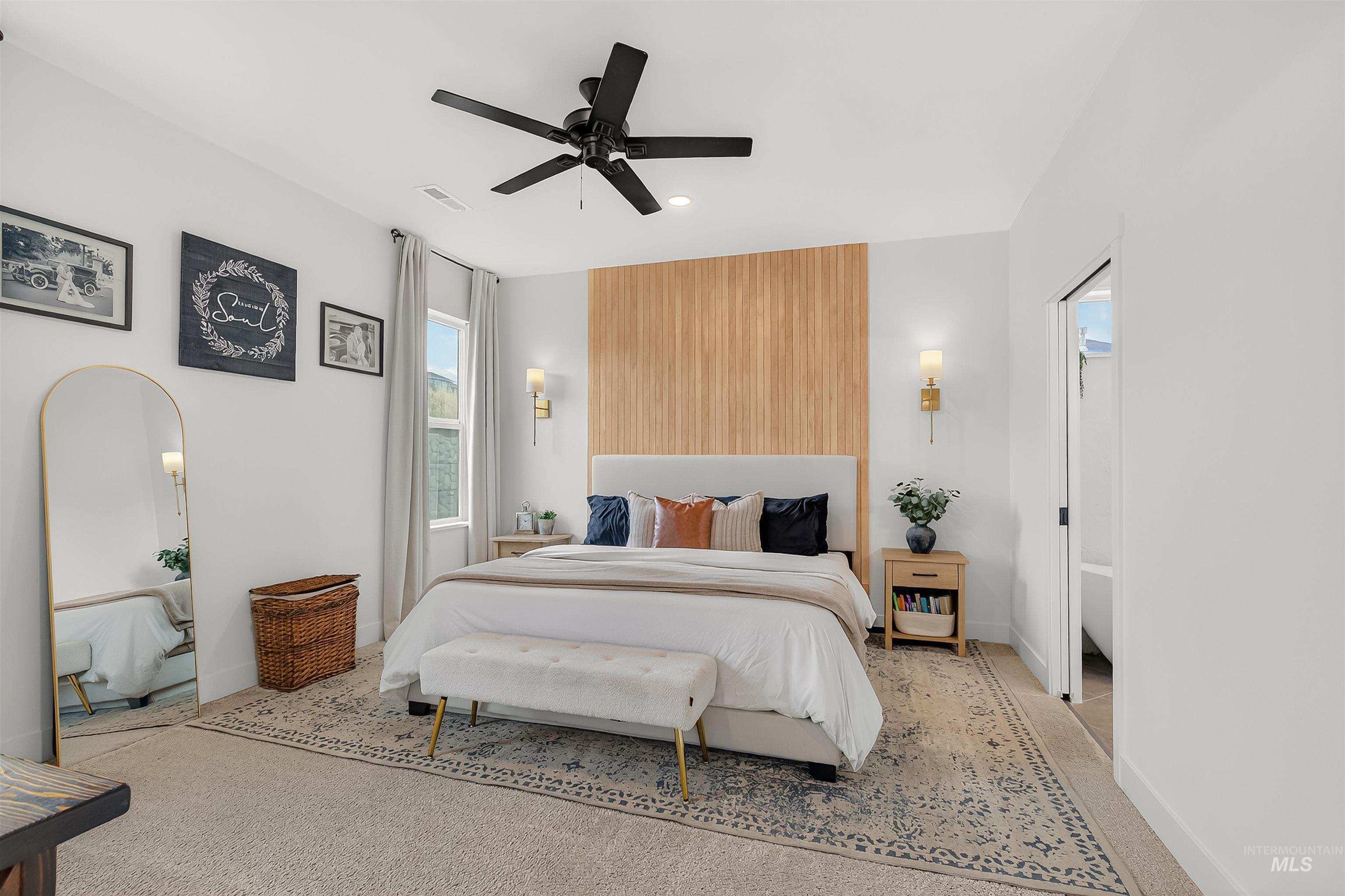 Carpeted bedroom featuring a ceiling fan and recessed lighting