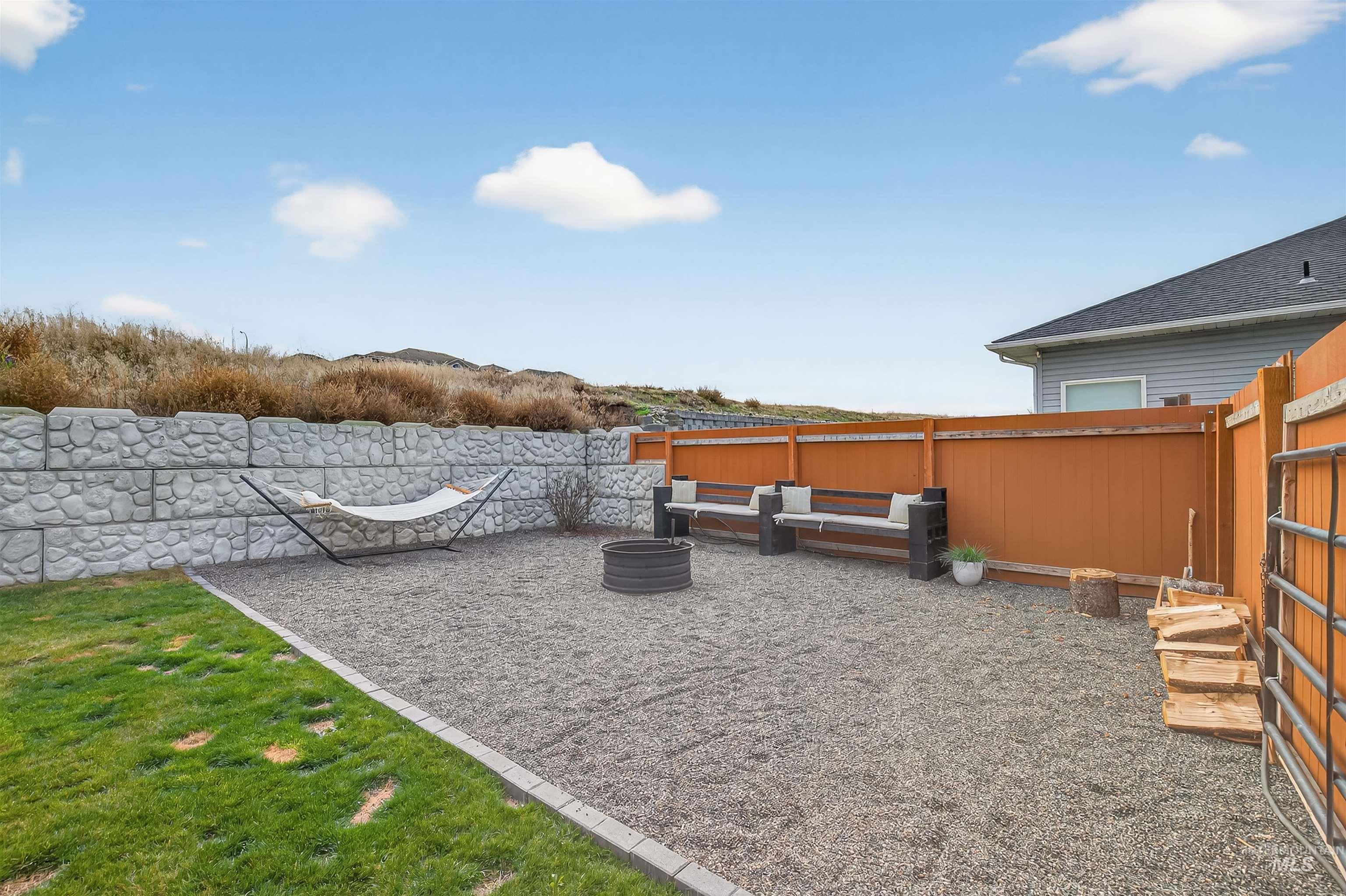 Fenced backyard featuring a patio