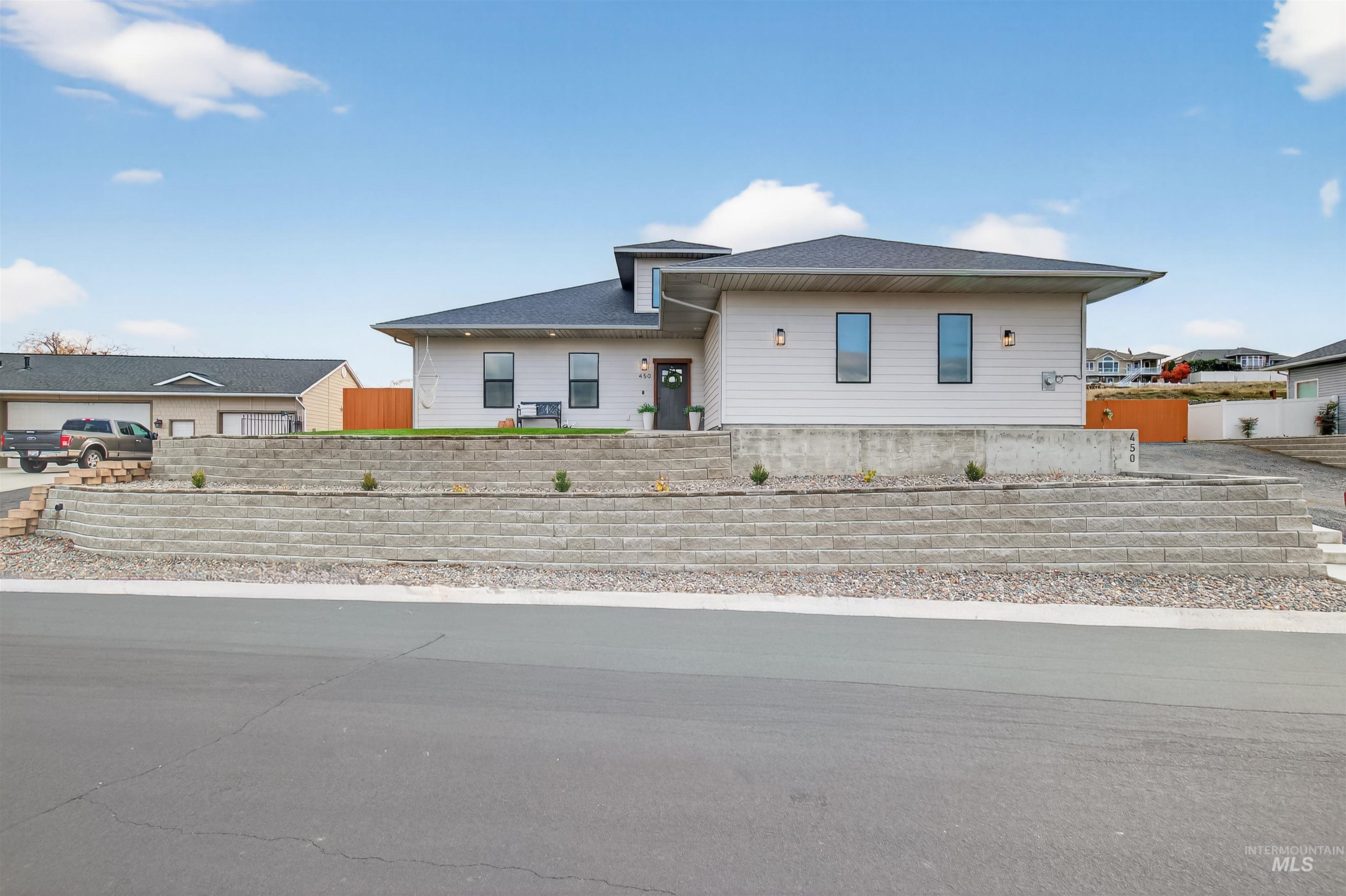View of front of property featuring a shingled roof