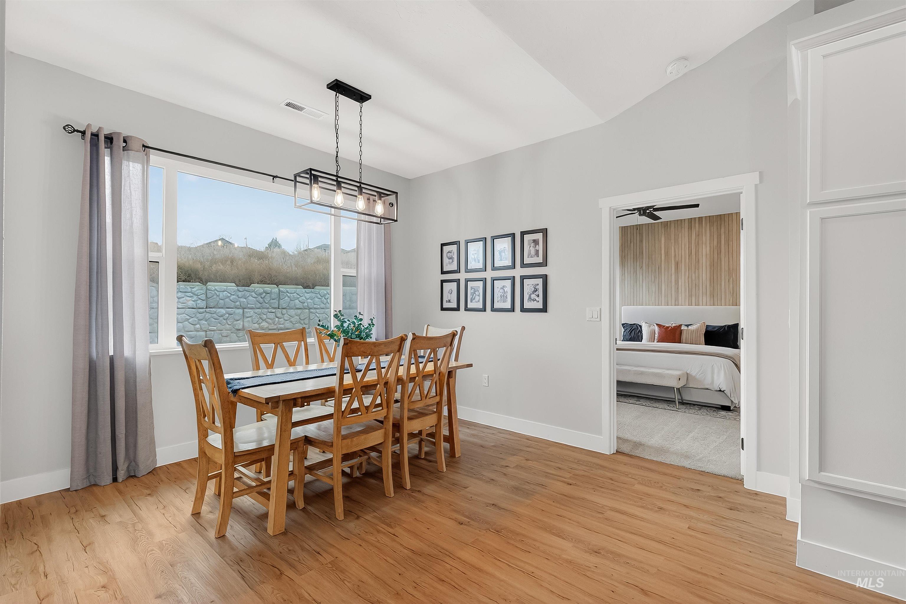 Dining area with light wood-type flooring