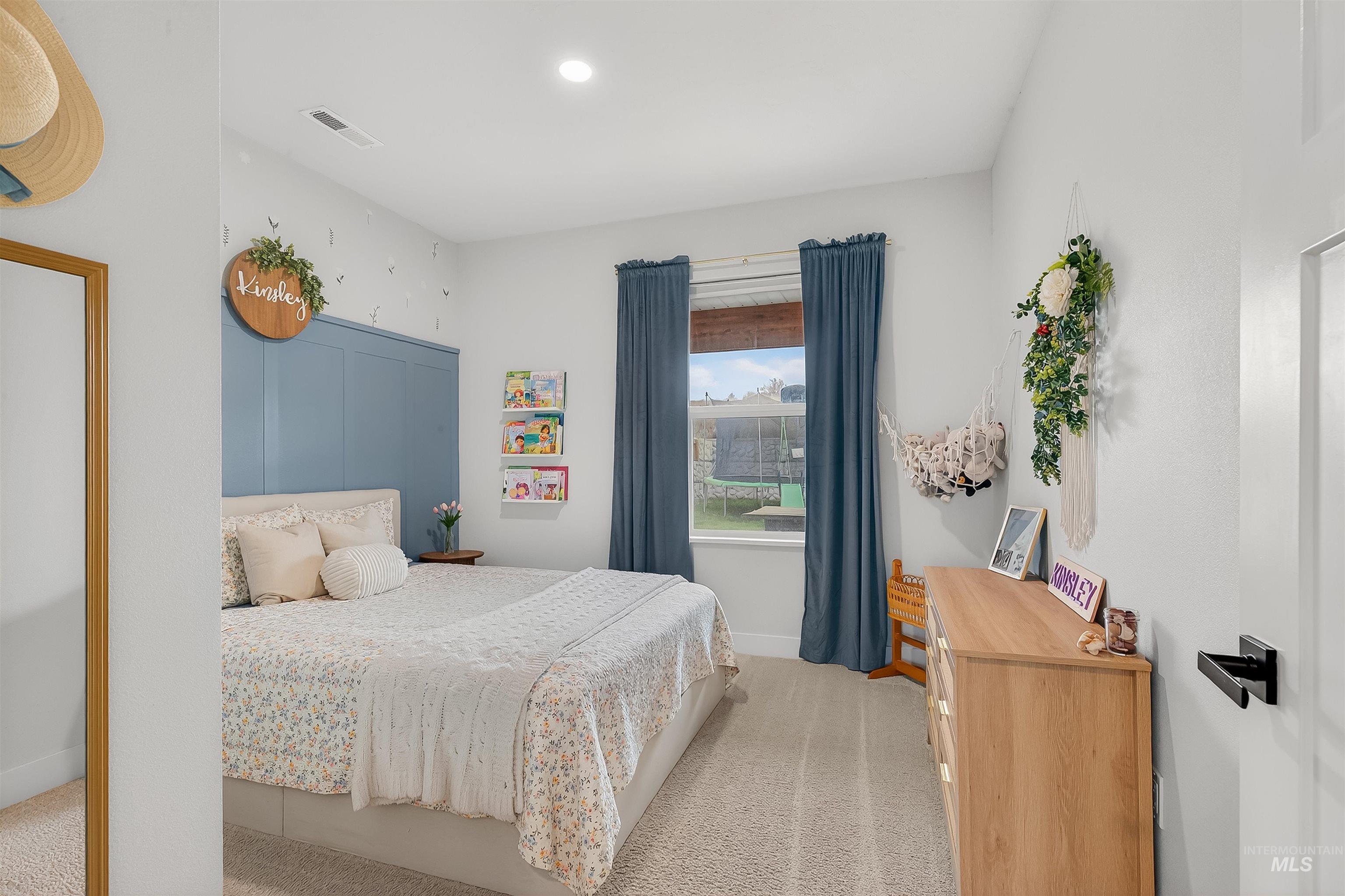 Bedroom with light carpet