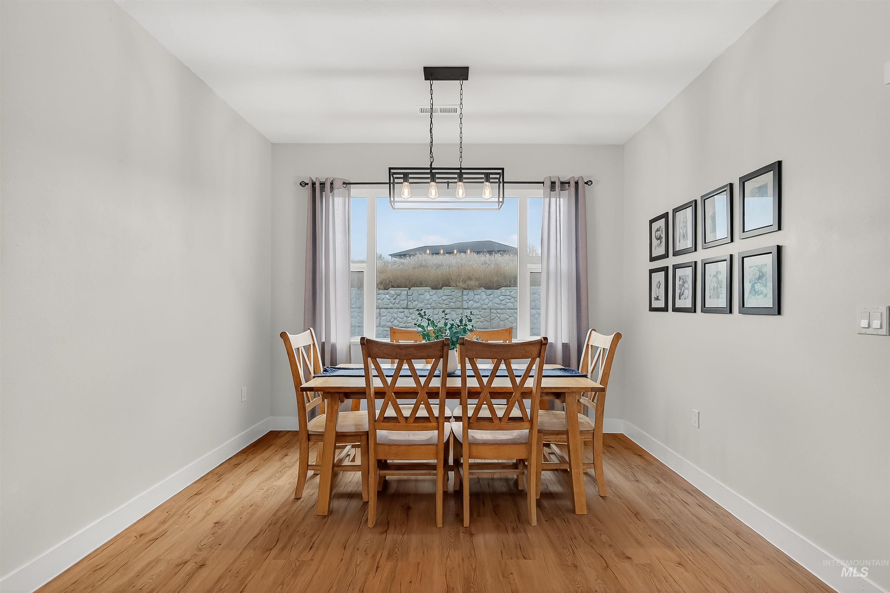Dining room with light wood-style floors