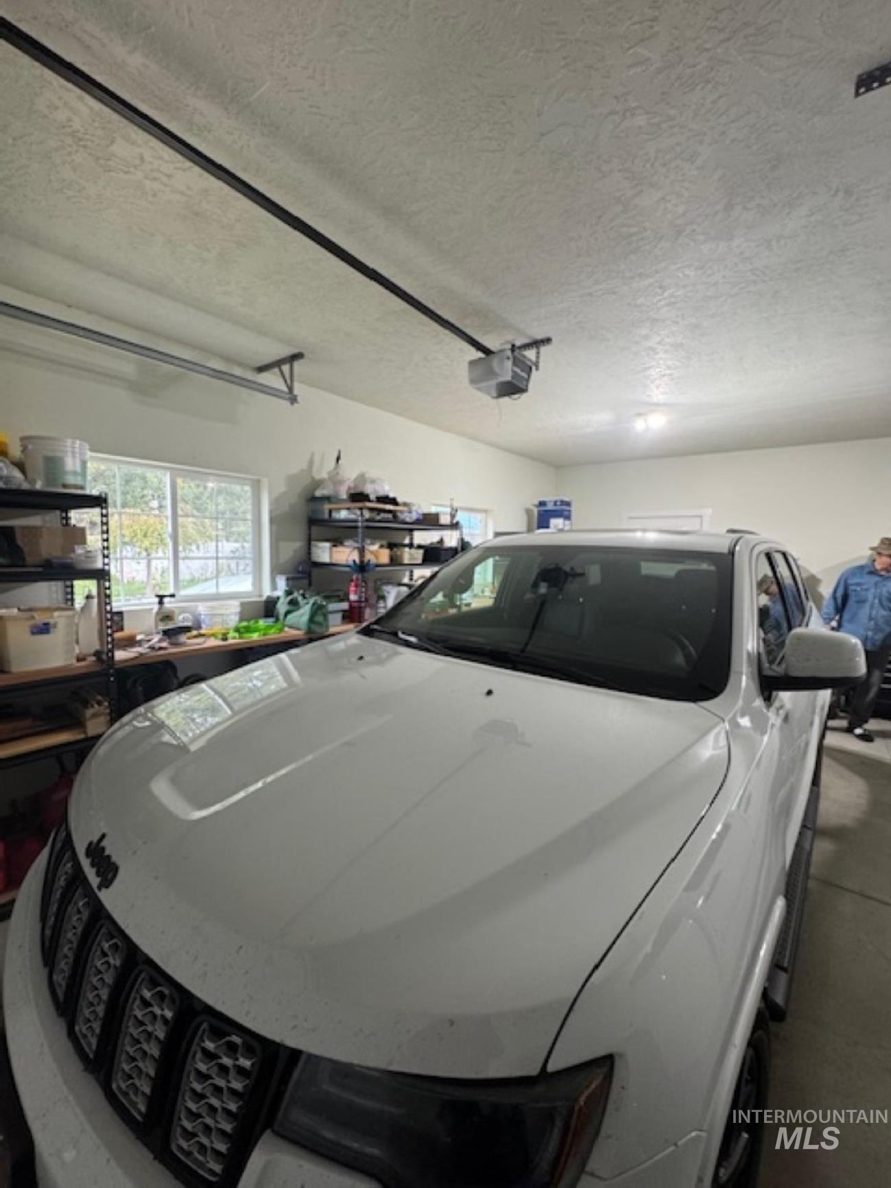 Garage featuring a garage door opener