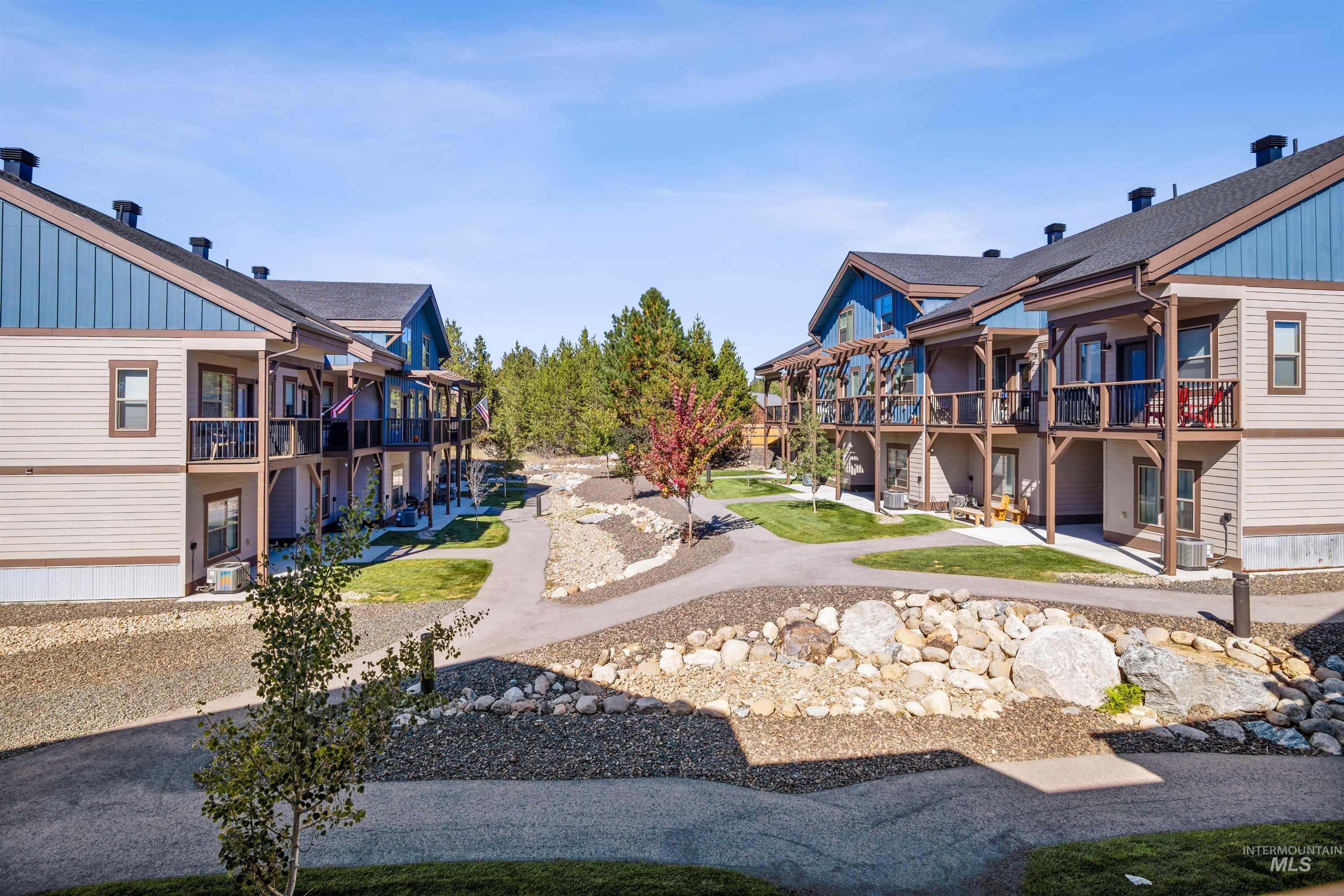 Surrounding community featuring a balcony and a lawn