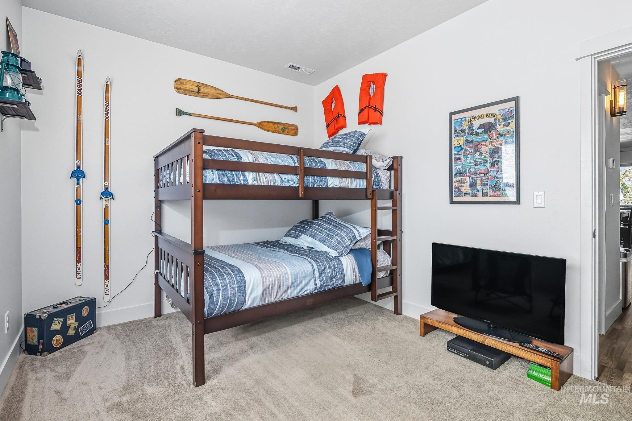 Bedroom with carpet flooring and baseboards
