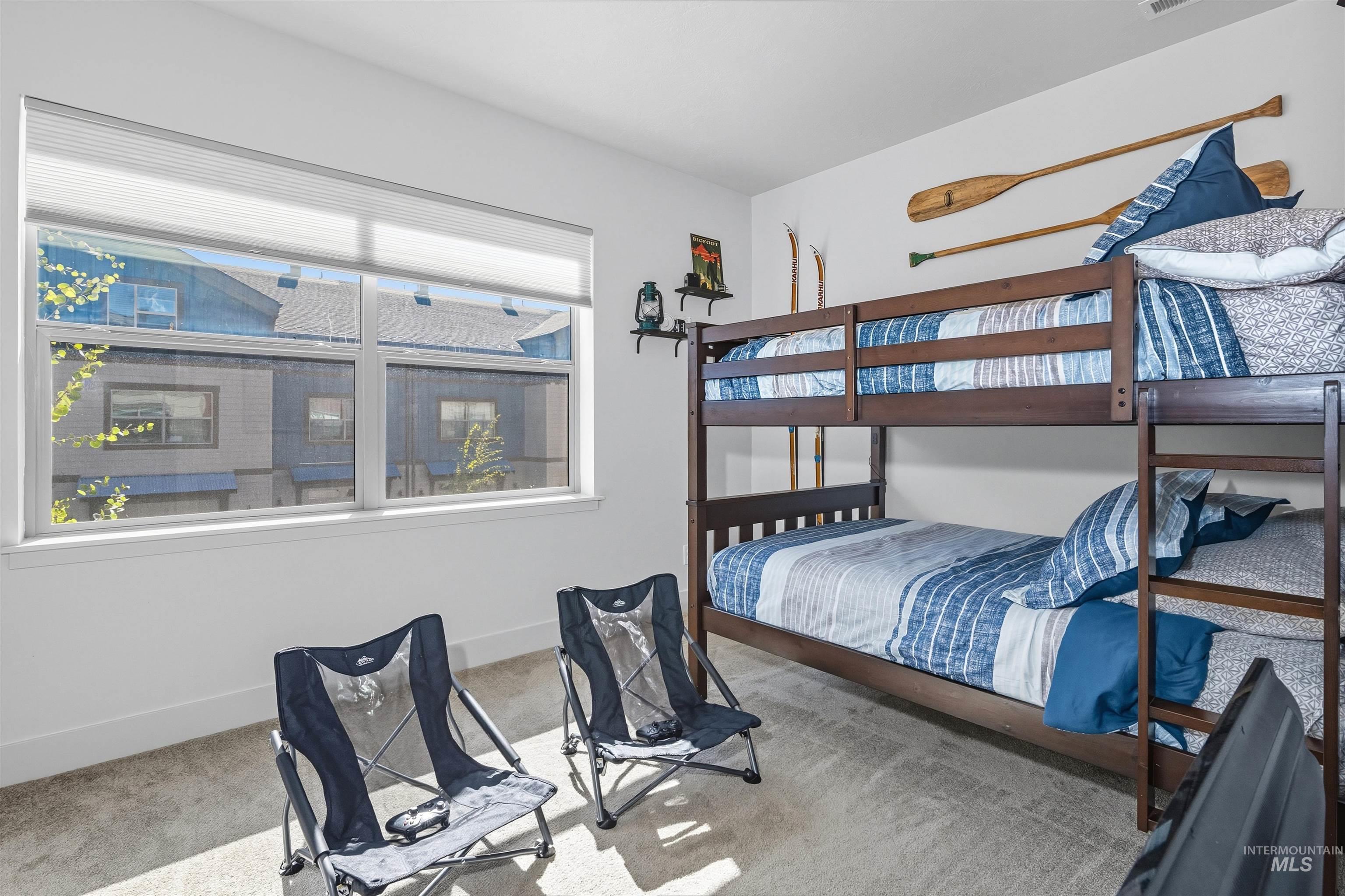 Bedroom with carpet floors and baseboards