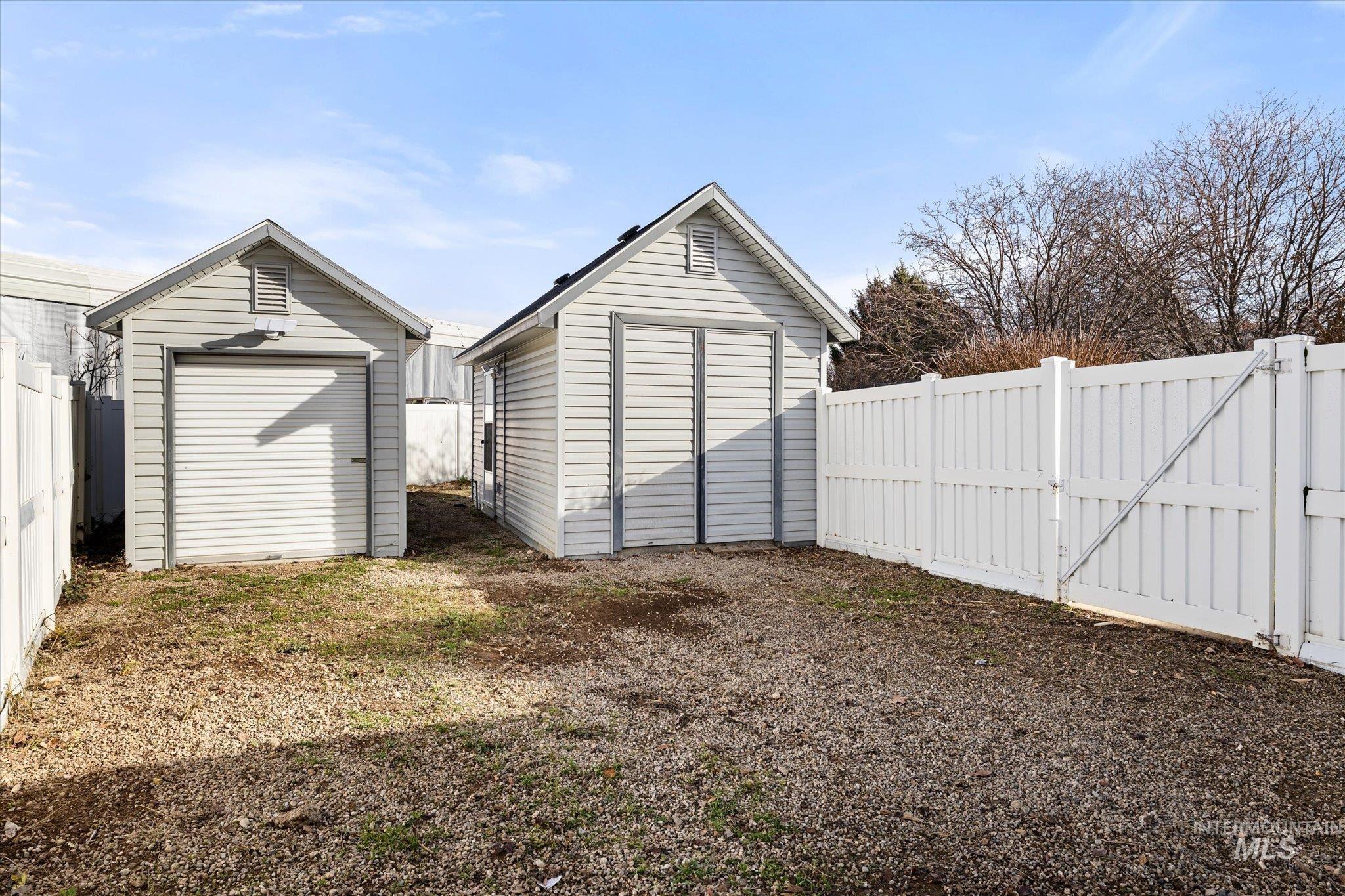 View of shed with a fenced backyard