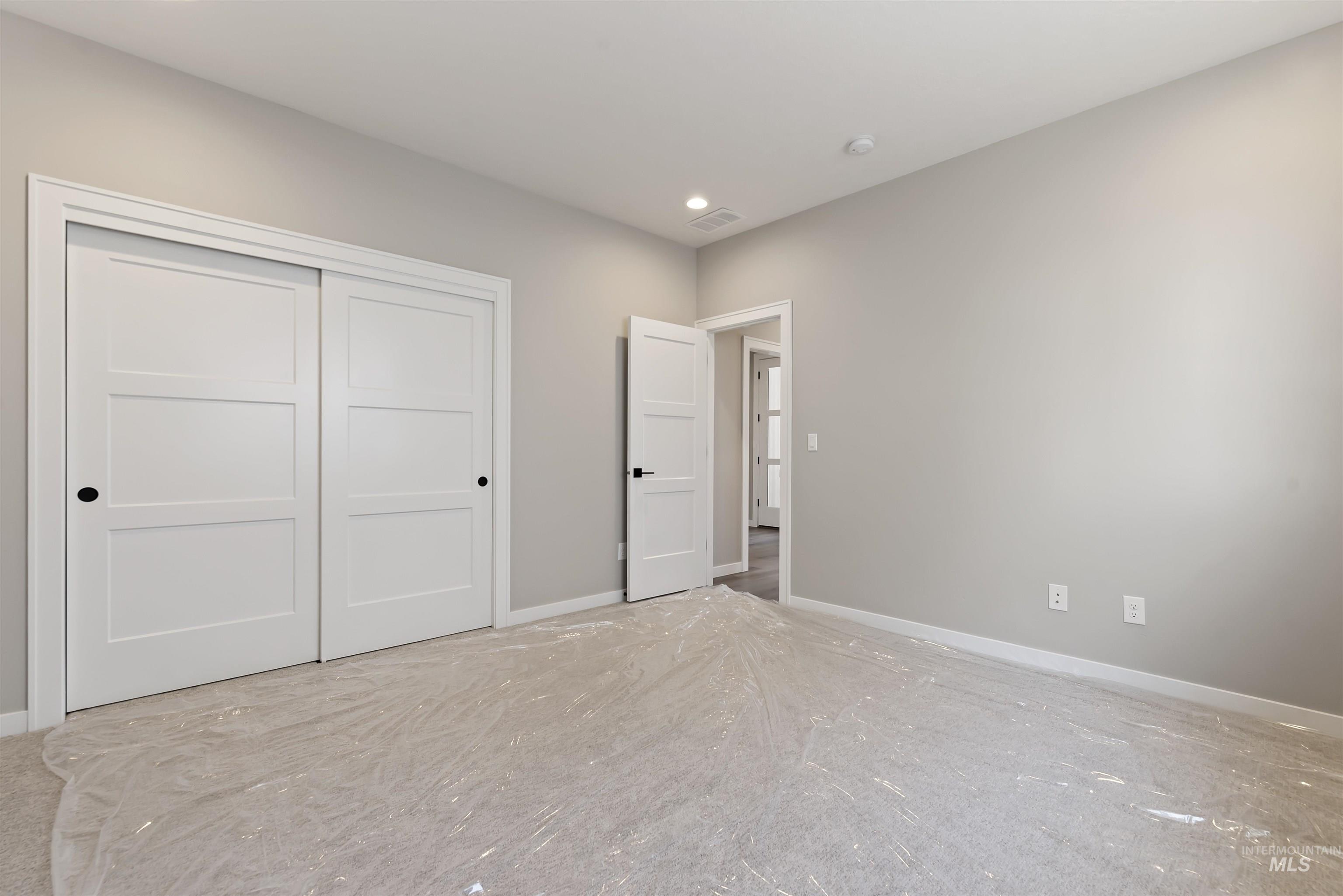 Unfurnished bedroom featuring a closet and recessed lighting
