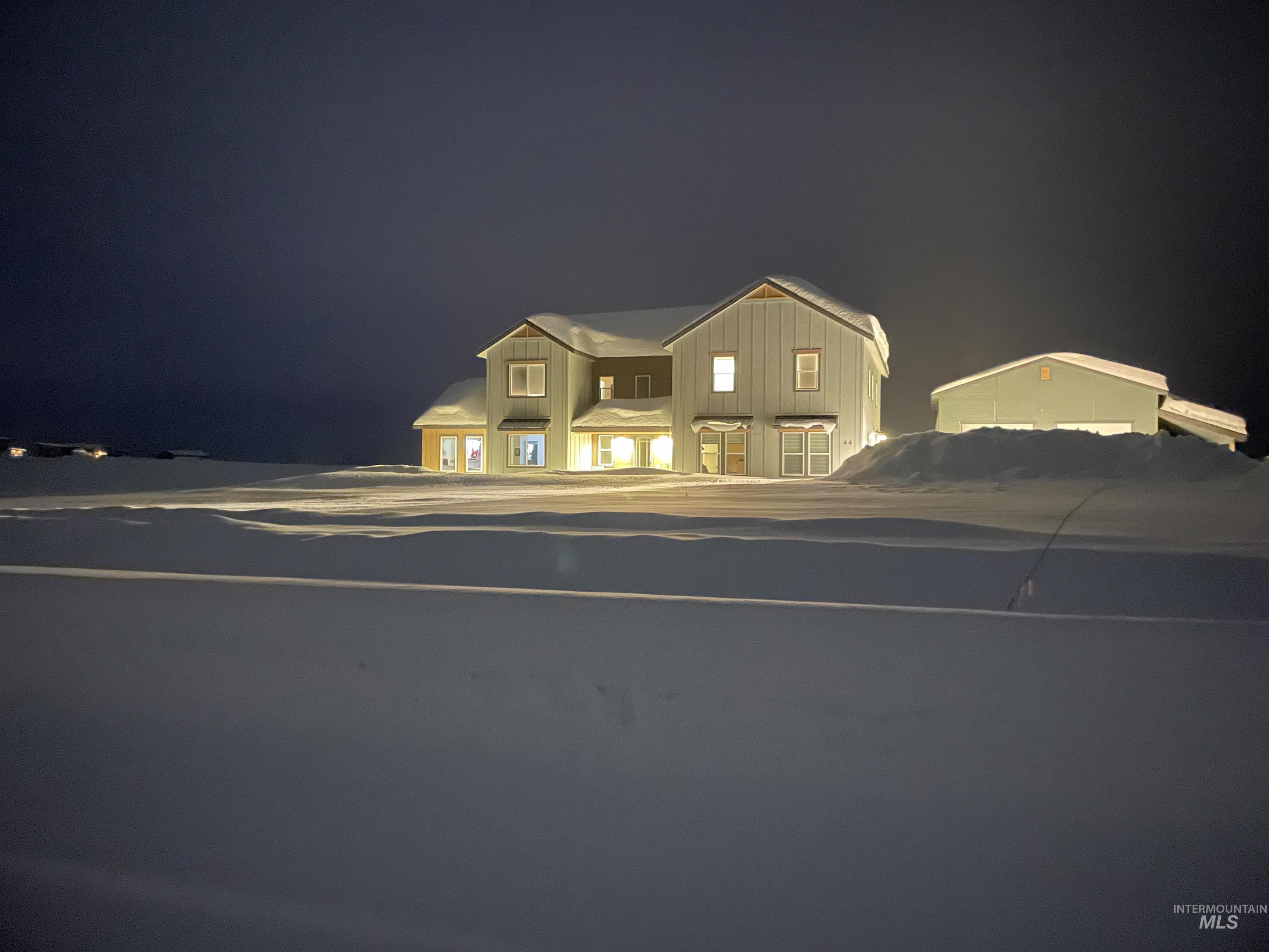 Two-story residential structure featuring multiple windows
