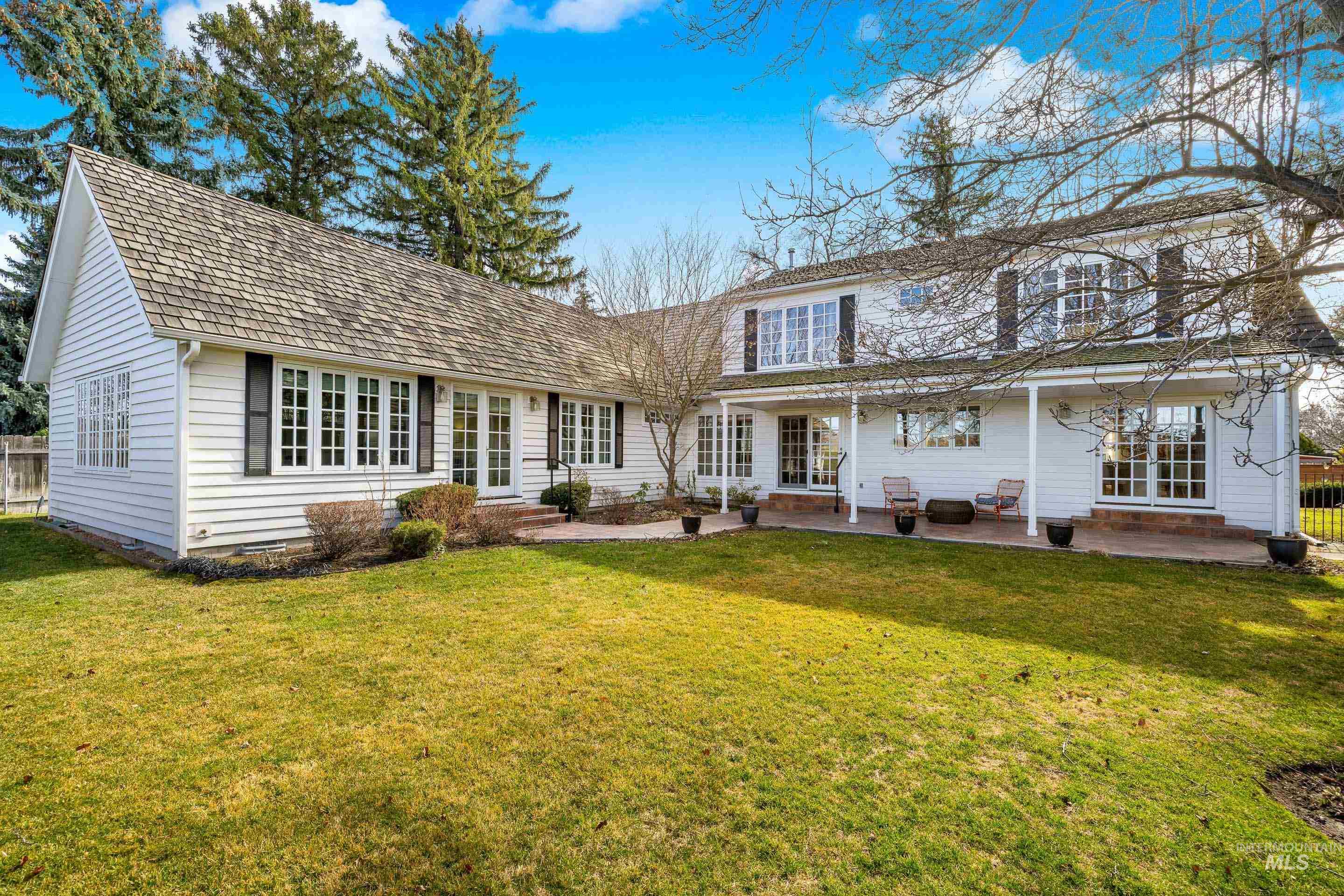 Rear view of house featuring a patio and crawl space