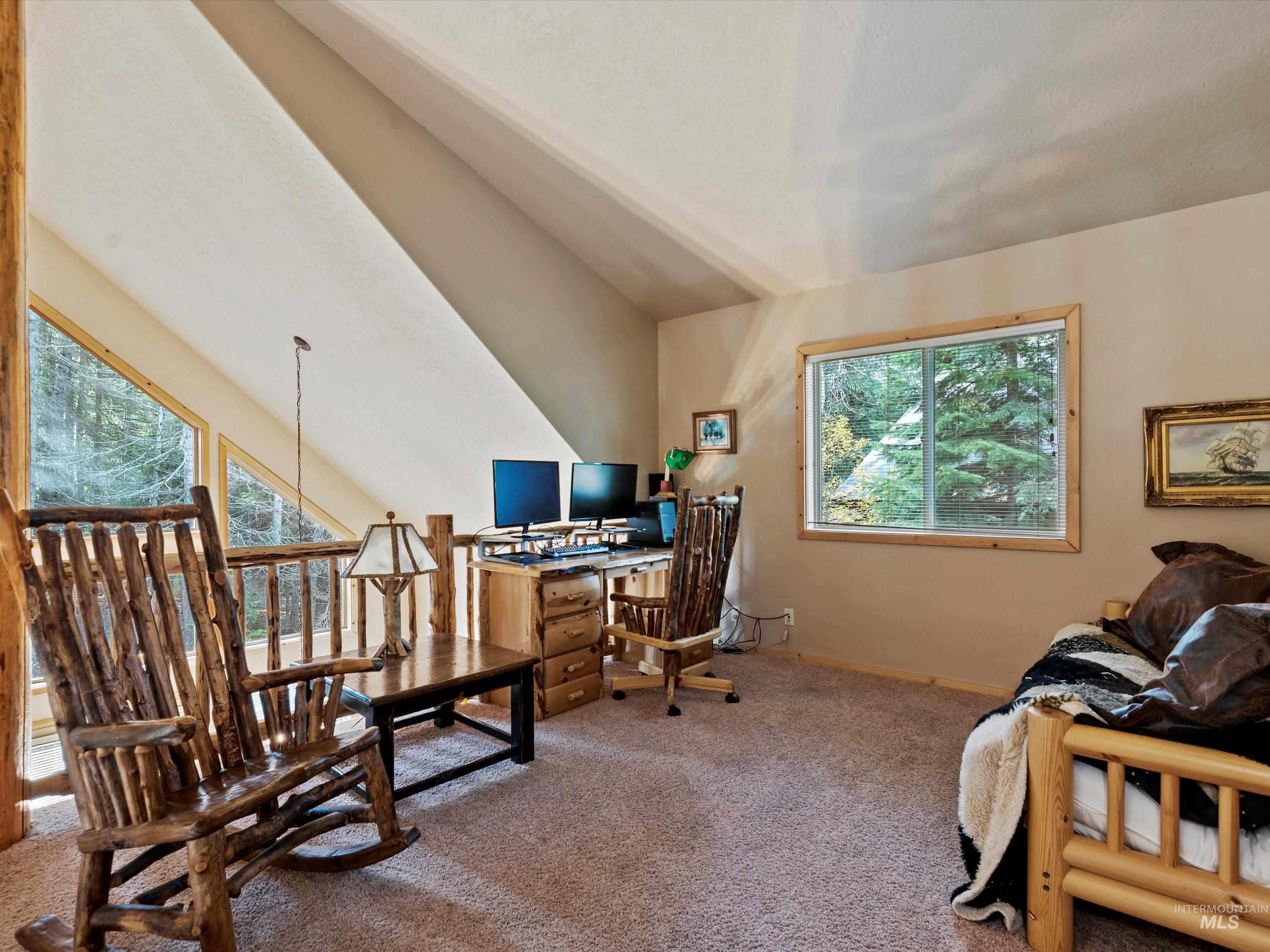 Carpeted office space featuring baseboards