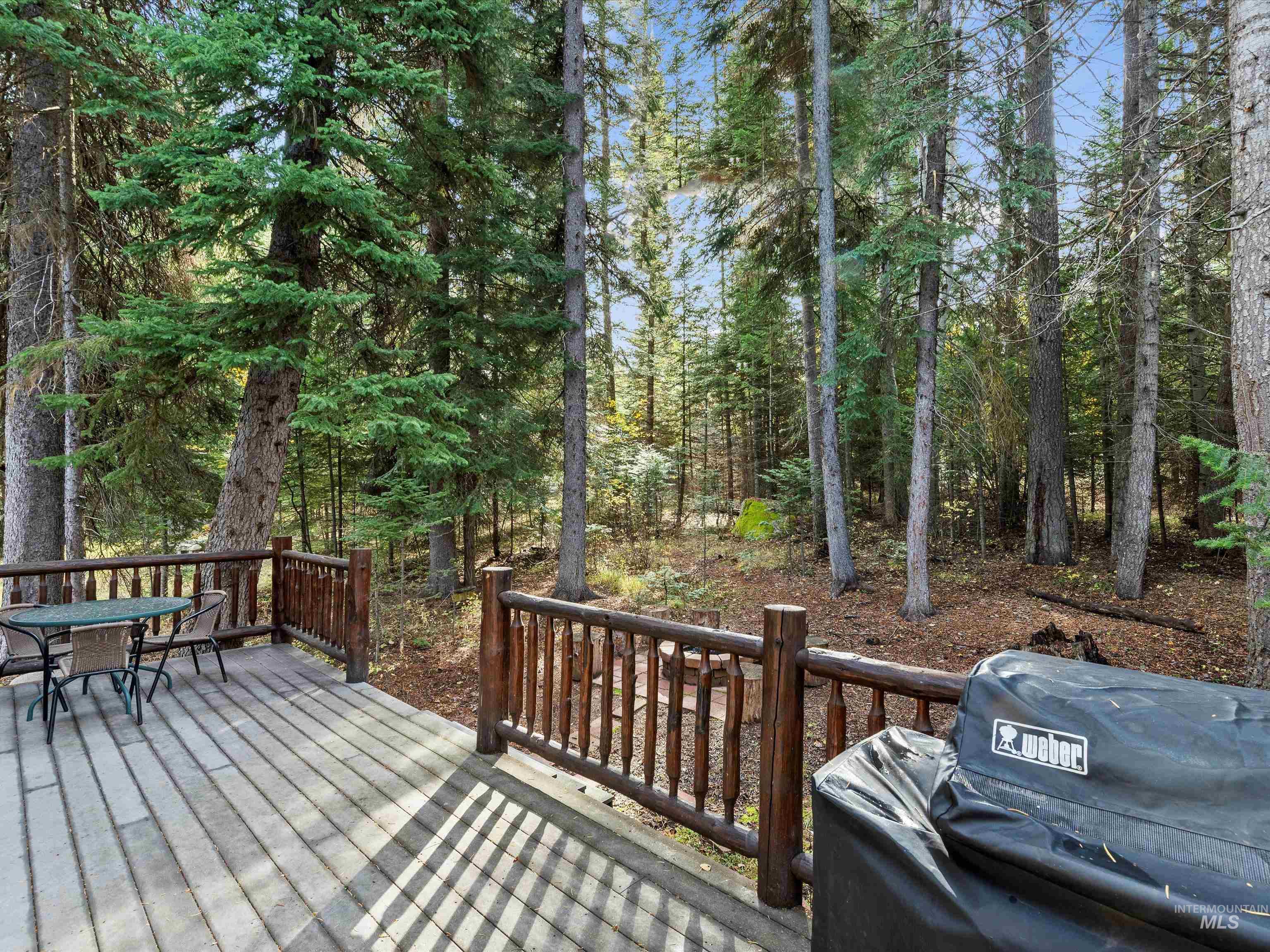 Deck with area for grilling and outdoor dining area