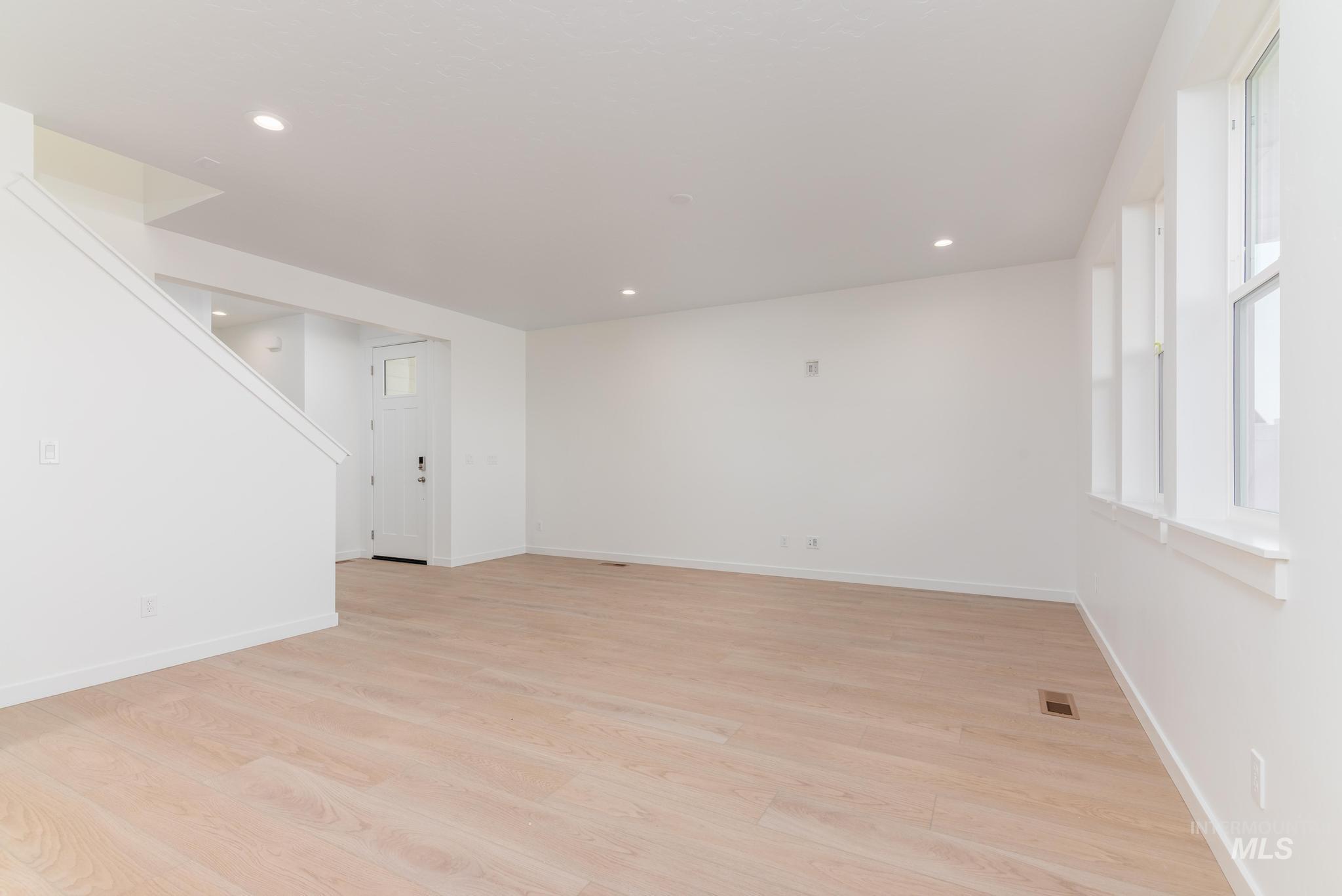 Unfurnished room featuring light wood-type flooring and recessed lighting