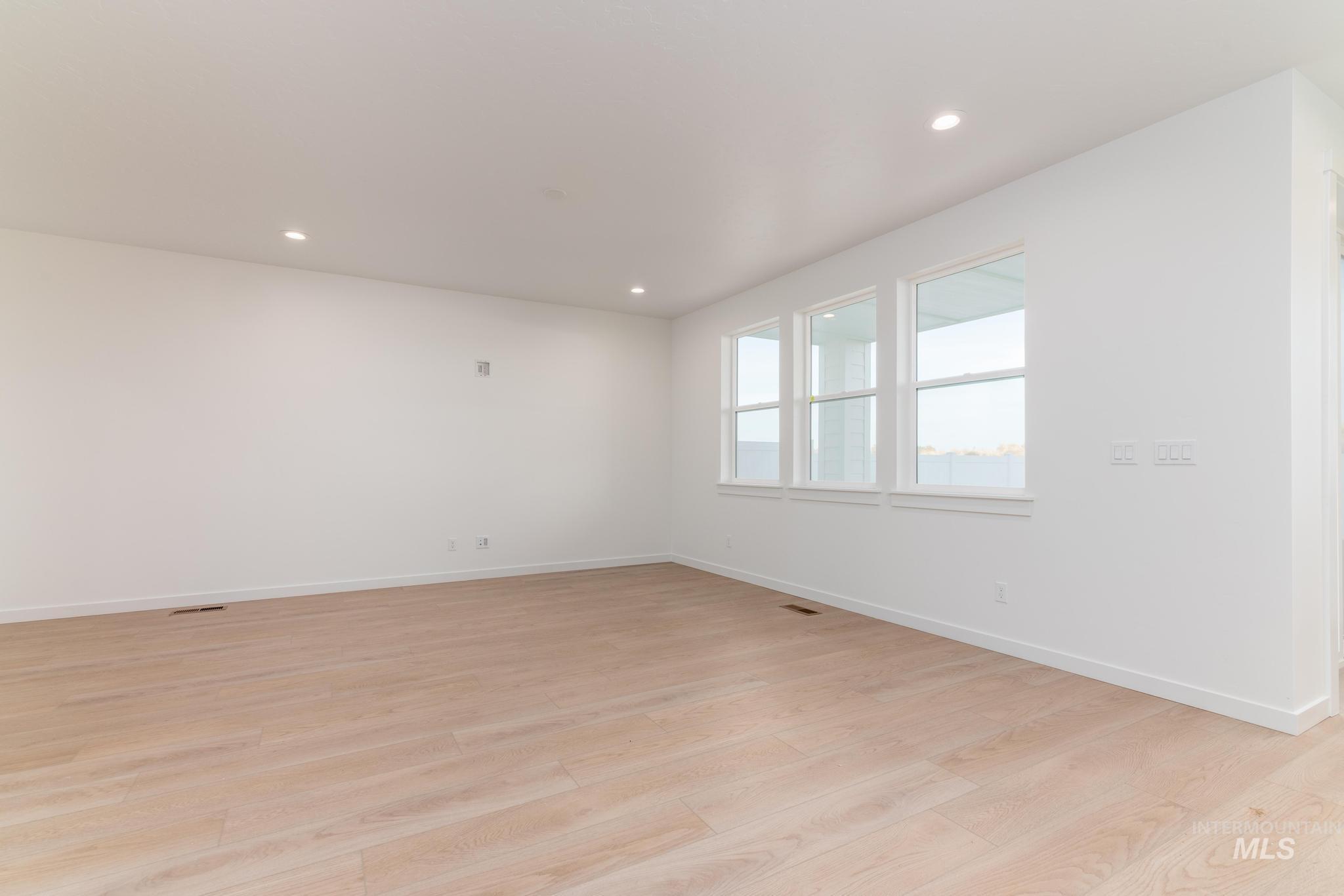 Unfurnished room featuring recessed lighting and light wood-style floors
