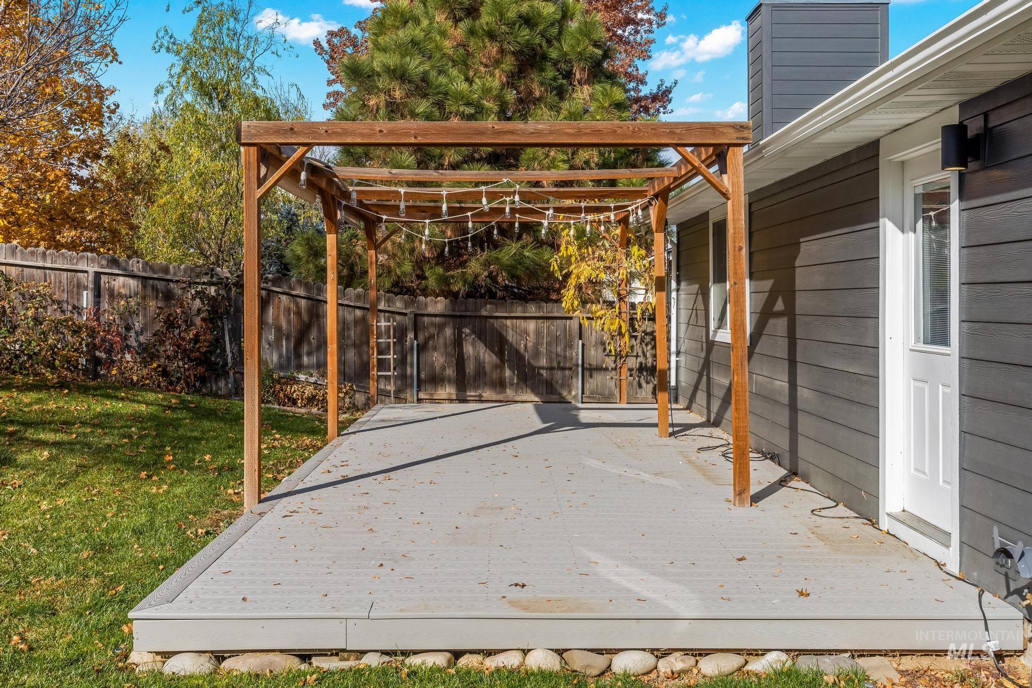 View of patio with a pergola and a wooden deck