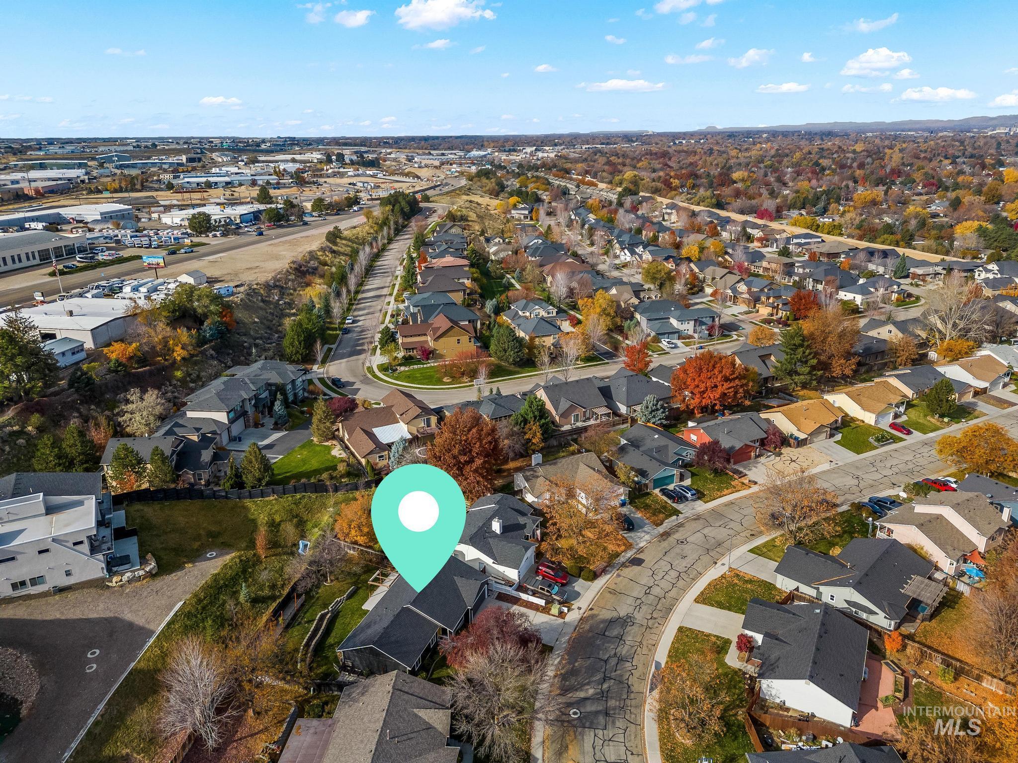 Aerial overview of property's location with nearby suburban area