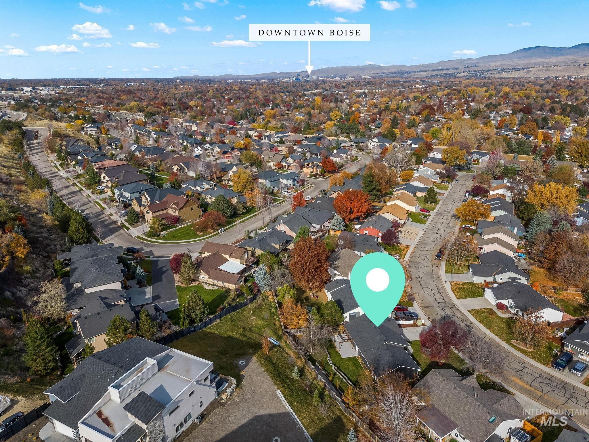 Aerial overview of property's location featuring nearby suburban area