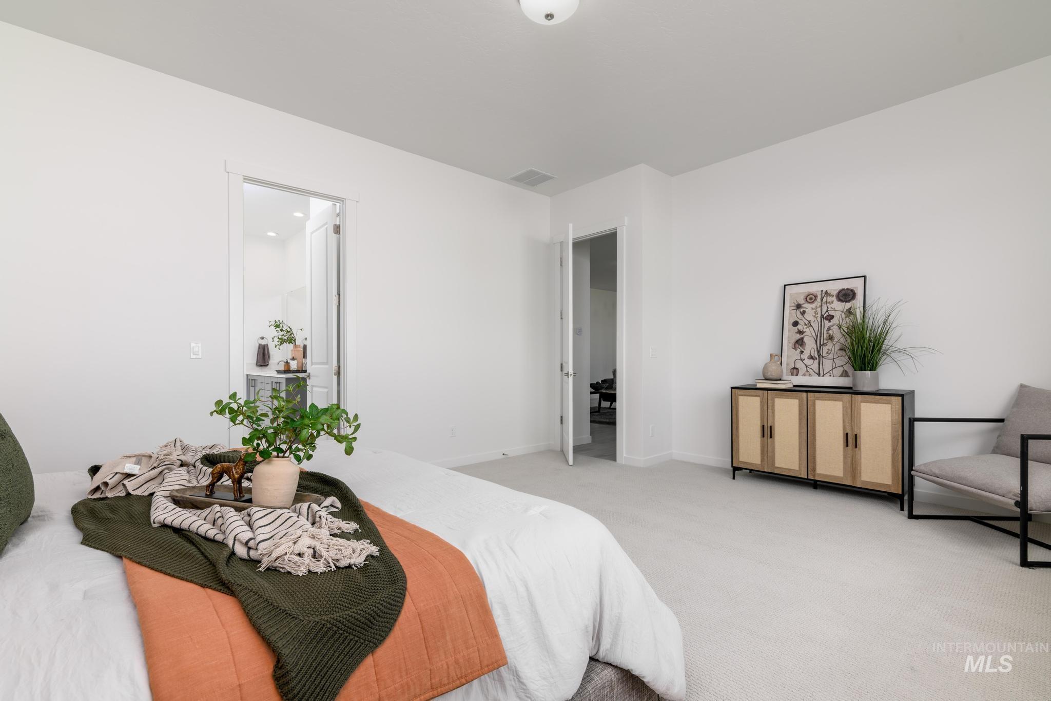 Carpeted bedroom with baseboards